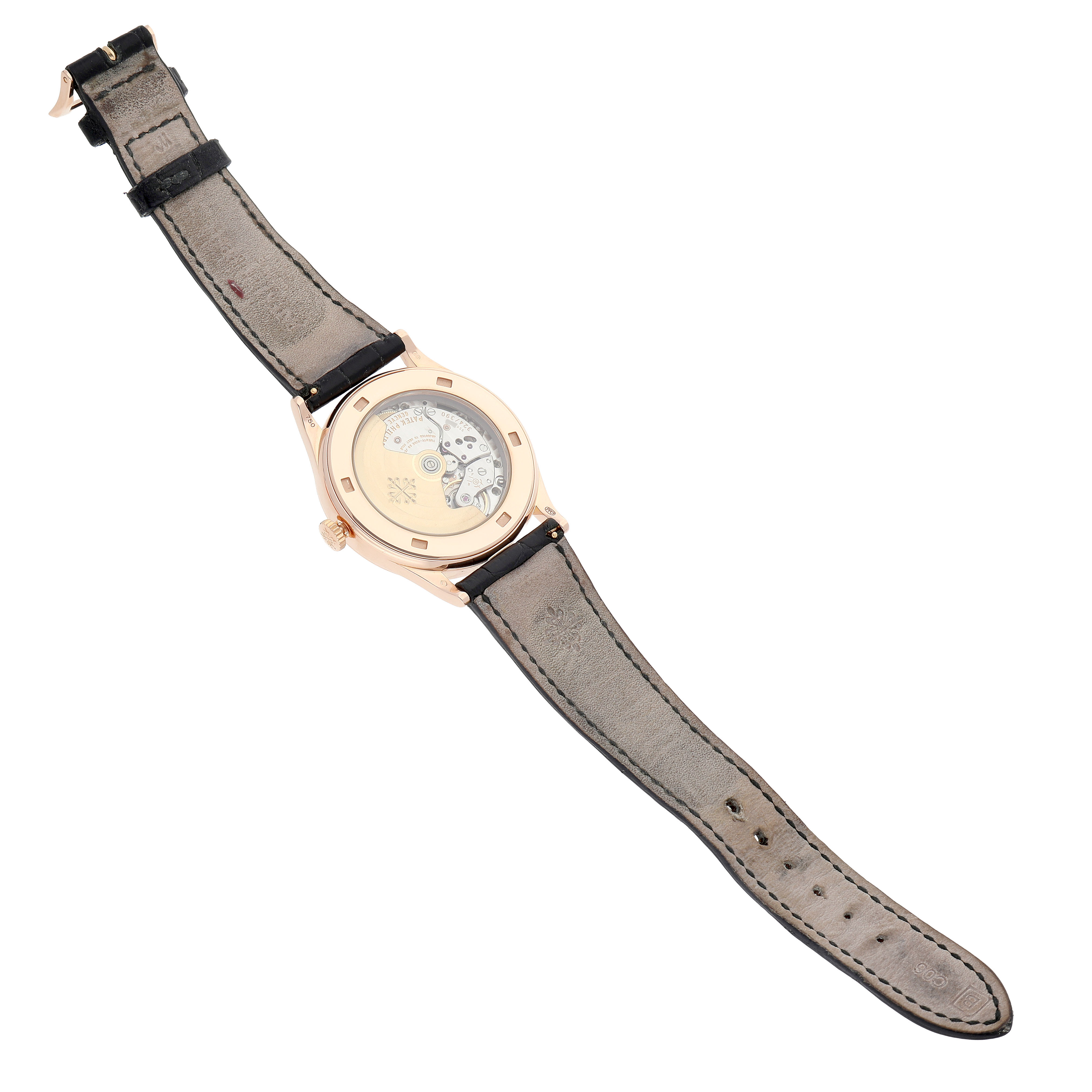 The image shows the back view of the Patek Philippe Calatrava 5296R-010 Men's Rose Gold Silver Dial watch, highlighting its movement and leather strap.