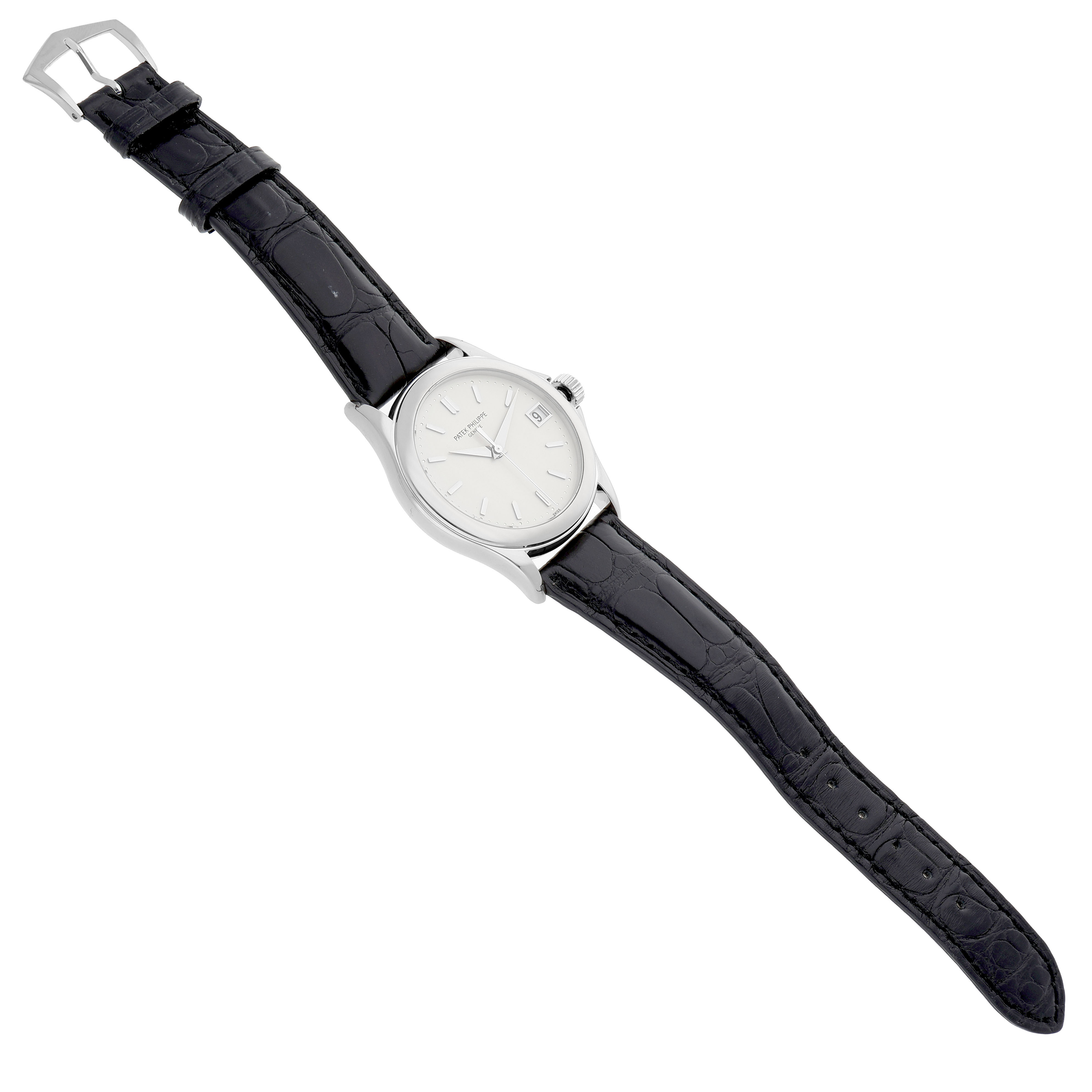 The Patek Philippe Calatrava 5107G Men's White Gold Silver Dial watch is shown at an oblique angle, displaying the face, case, and black leather strap.