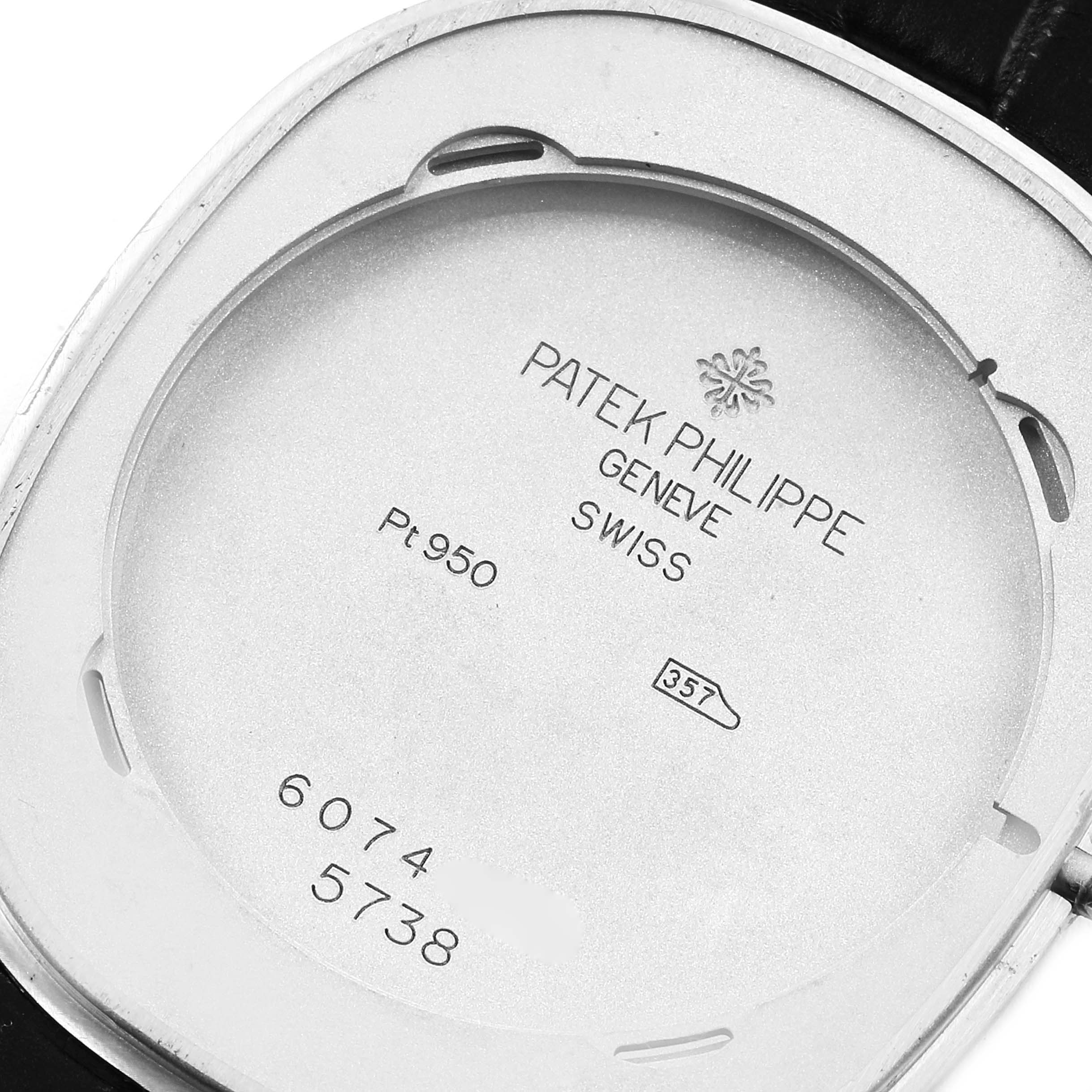 The image shows the back case of a Patek Philippe Golden Ellipse 5738P-001 Men's Platinum Blue Dial 5738P-001 Men's Platinum Blue Dial watch with model numbers and inscriptions visible.