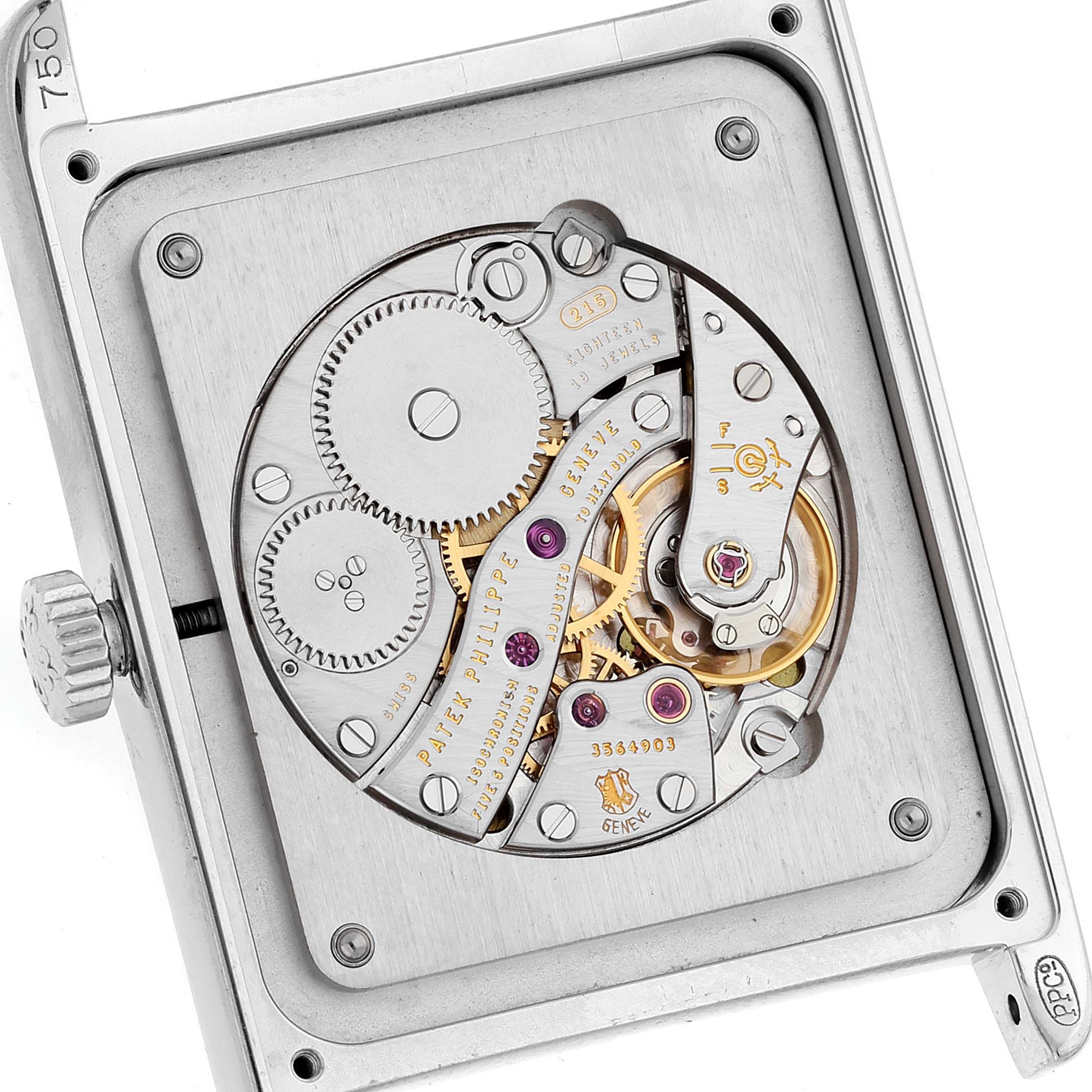 The image shows a close-up of the Patek Philippe Gondolo 5112G Men's White Gold Black Dial 5112G Men's White Gold Black Dial watch movement from the back, displaying intricate gears and mechanisms.