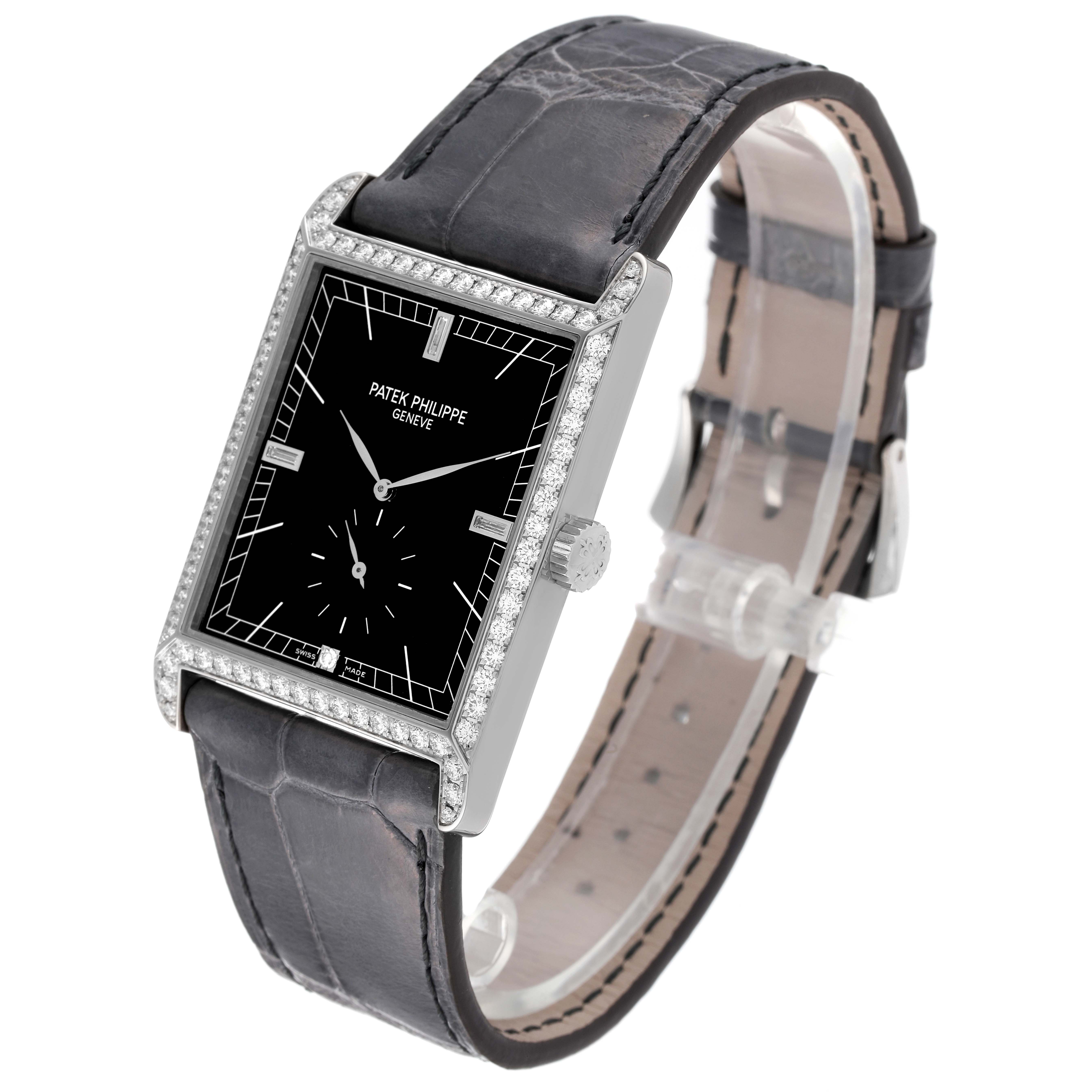 The image shows a Patek Philippe Gondolo 5112G Men's White Gold Black Dial 5112G Men's White Gold Black Dial watch at an angled view, highlighting its rectangular dial, black leather strap, and diamond-set bezel.