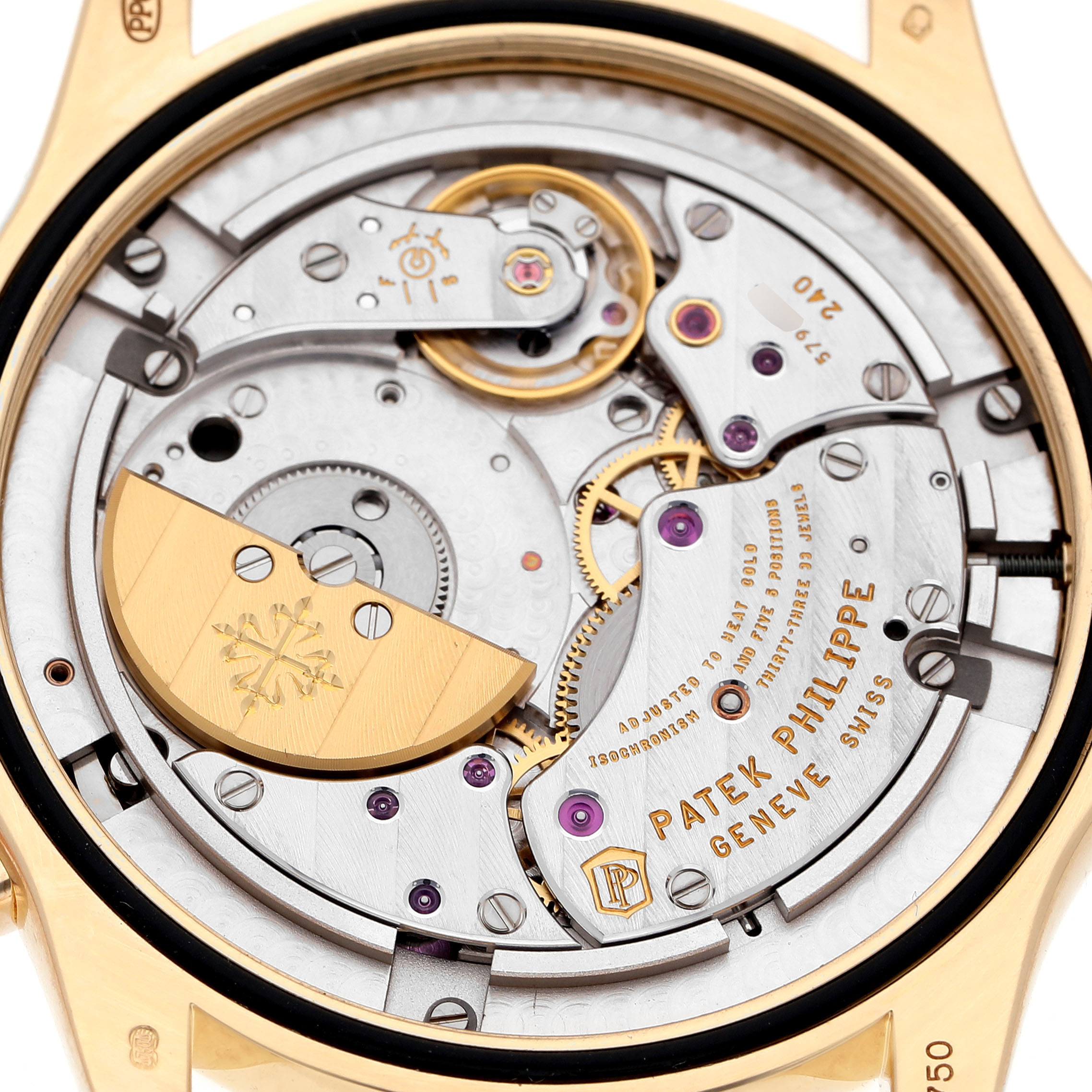 The image shows the rear view of the Patek Philippe Complications 5130J Men's Yellow Gold Silver Dial model, highlighting its intricate movement and gold rotor.