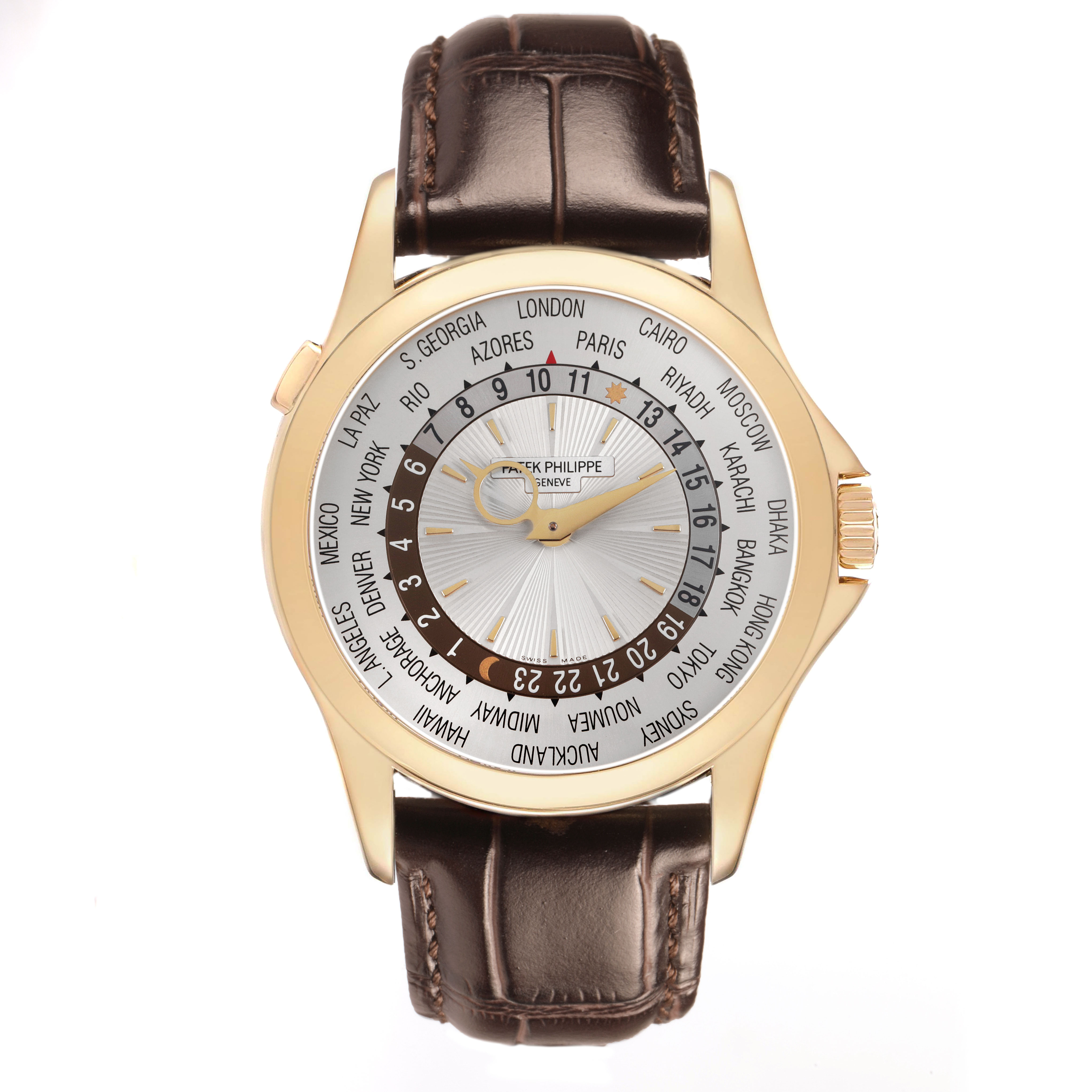 The Patek Philippe Complications 5130J Men's Yellow Gold Silver Dial watch is shown from a top view, highlighting the dial, world time feature, and leather strap.