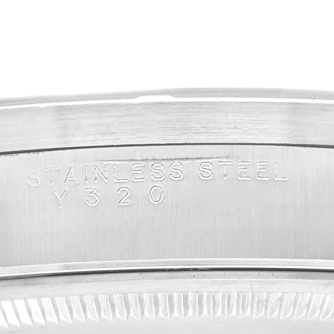 This image shows a close-up of the Rolex Air-King 14010 Men's Stainless Steel Blue Dial 14010 Men's Stainless Steel Blue Dial model's stainless steel case, highlighting the engraved text.