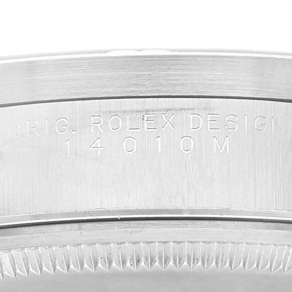 This close-up shows the side of the bezel and case edge of the Rolex Air-King 14010 Men's Stainless Steel Blue Dial 14010 Men's Stainless Steel Blue Dial, featuring the engraved model number 14010M.