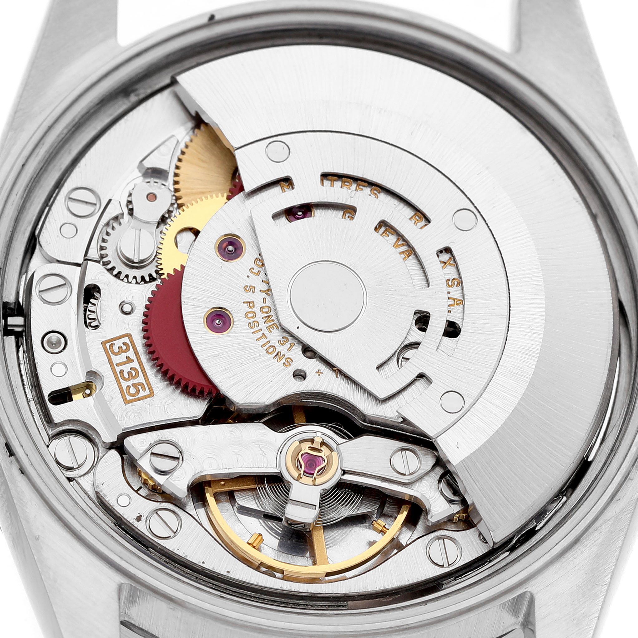 The image shows the Rolex Date 15210 Men's Stainless Steel Blue Dial watch movement from the back, highlighting gears and the rotor.