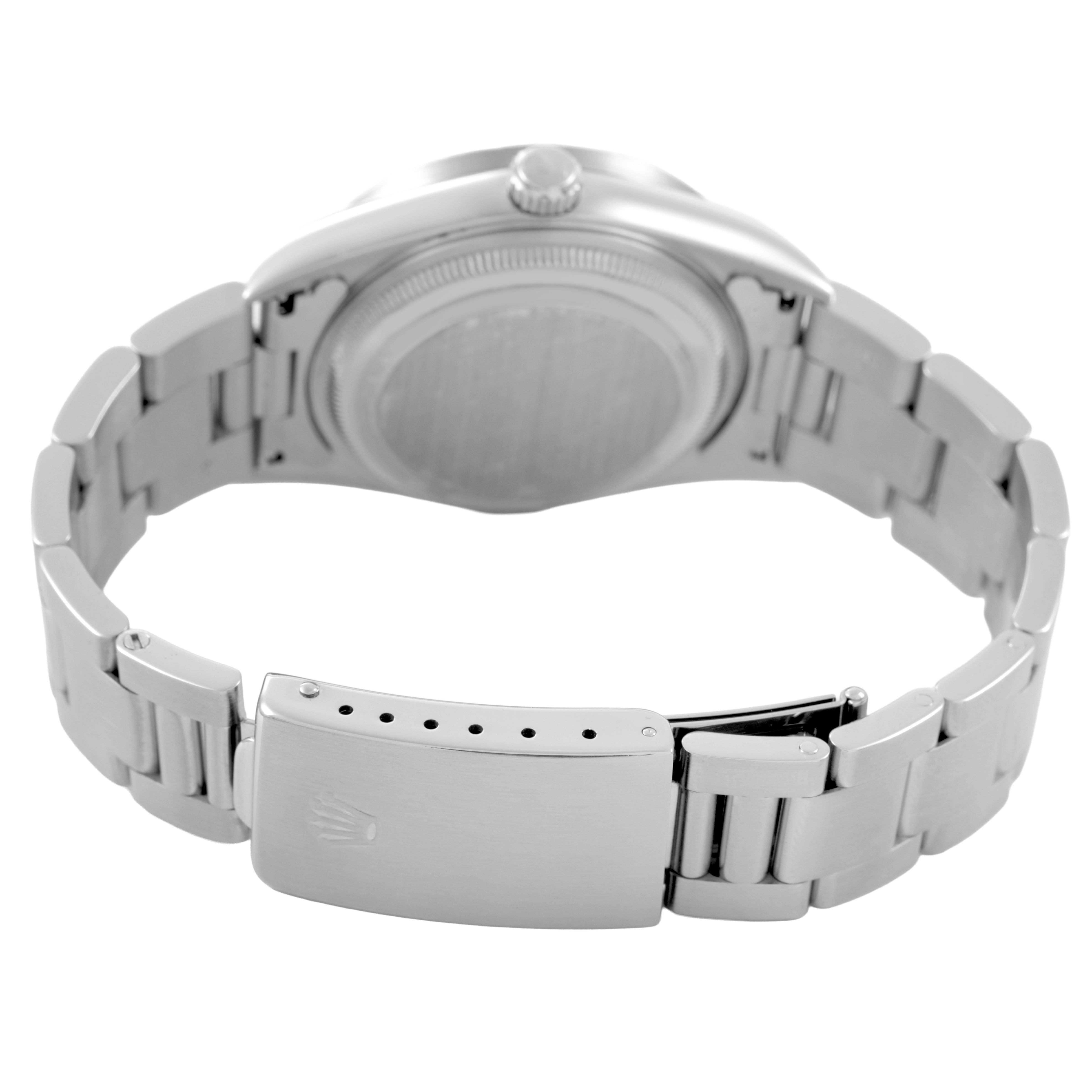 The image shows the Rolex Date 15210 Men's Stainless Steel Blue Dial model from the back, highlighting the case back, bracelet, and clasp.