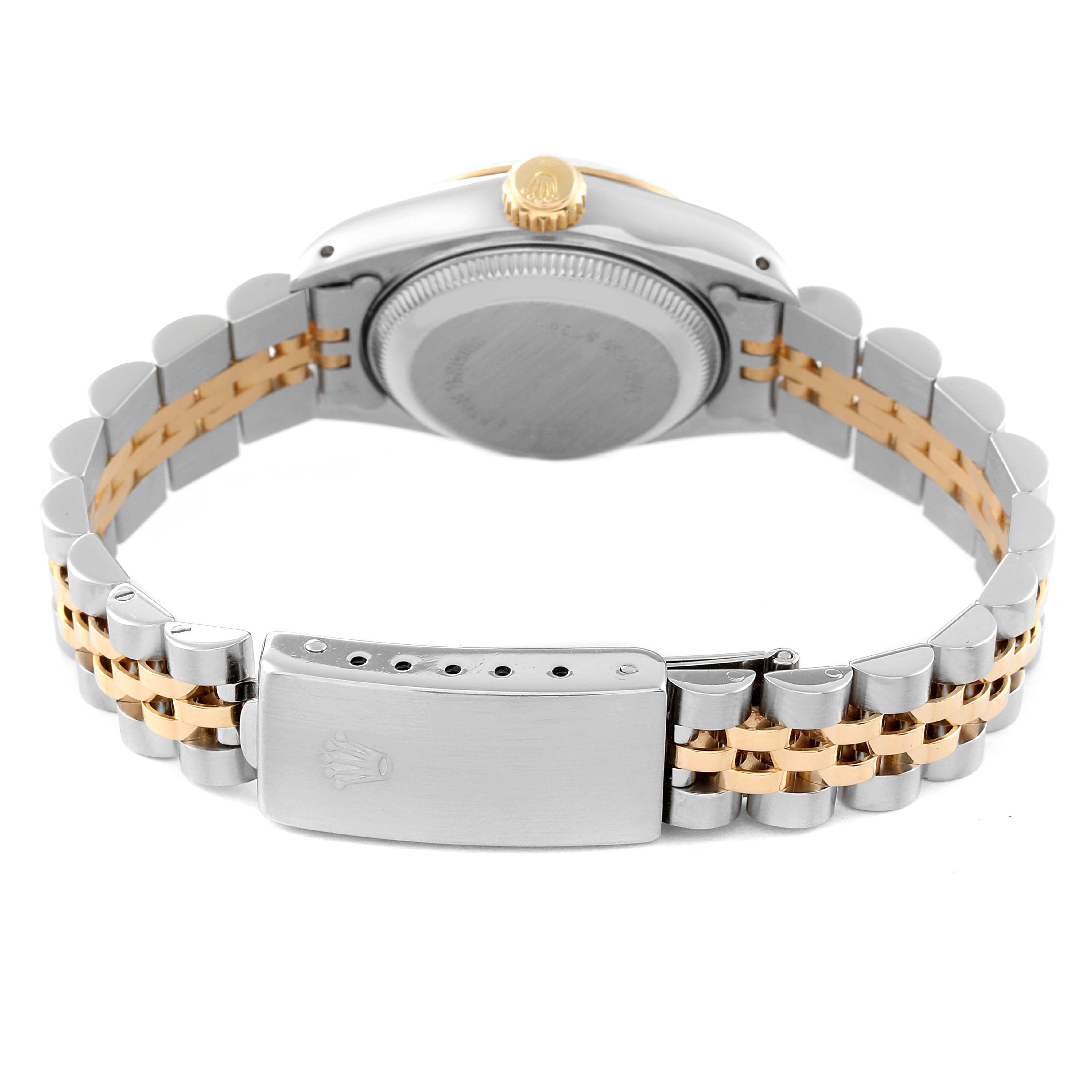 The image shows the back view of a Rolex Date 69173 Women's Steel and Gold (two tone) Silver Dial 69173 Women's Steel and Gold (two tone) Silver Dial model watch, highlighting the case back, crown, and two-tone bracelet with clasp.