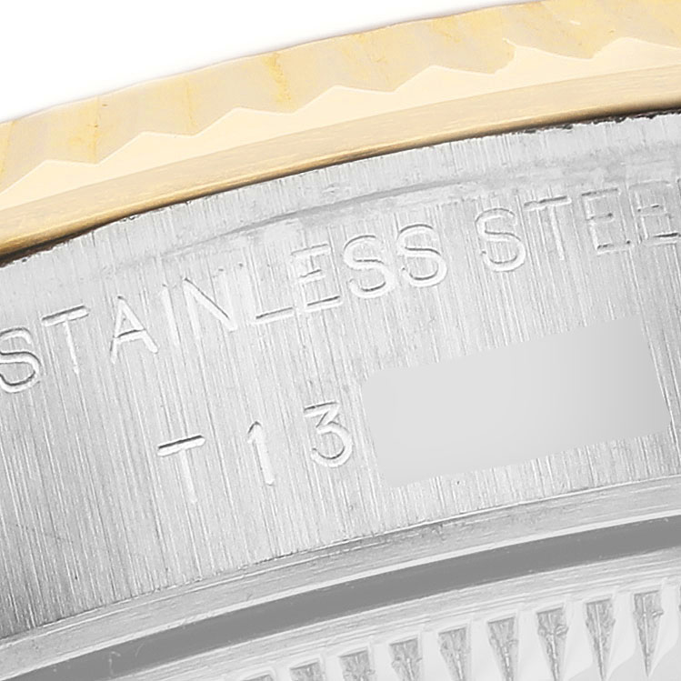 The image shows a close-up of the case side and partial bezel of a Rolex Datejust 69173 Women's Steel and Gold (two tone) Champagne Dial watch, highlighting the engraved text.