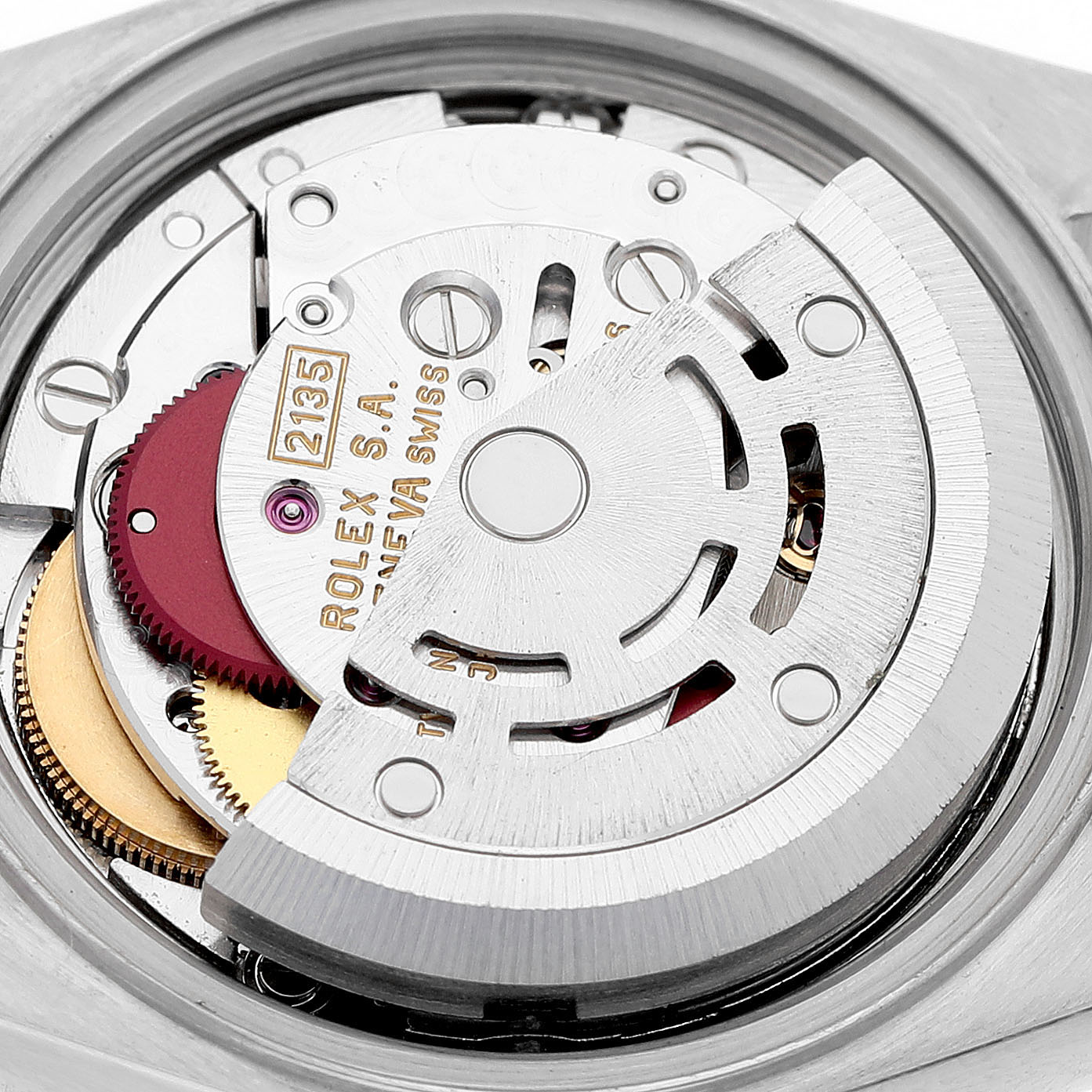 The image shows the movement mechanism of a Rolex Datejust 69173 Women's Steel and Gold (two tone) Champagne Dial watch from a close-up, focusing on the rotor and gears.