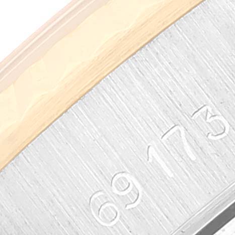 This close-up image shows the reference number engraved on the side of a Rolex Datejust 69173 Women's Steel and Gold (two tone) Champagne Dial 69173 Women's Steel and Gold (two tone) Champagne Dial watch case.