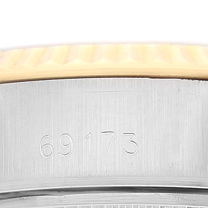 The image shows a close-up view of the side of a Rolex Datejust 69173 Women's Steel and Gold (two tone) Champagne Dial 69173 Women's Steel and Gold (two tone) Champagne Dial watch case, highlighting the model number and part of the bezel.