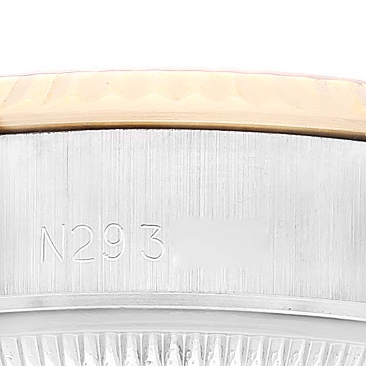 This image shows a close-up of the serial number engraving on the case side of a Rolex Datejust 69173 Women's Steel and Gold (two tone) Champagne Dial 69173 Women's Steel and Gold (two tone) Champagne Dial watch.