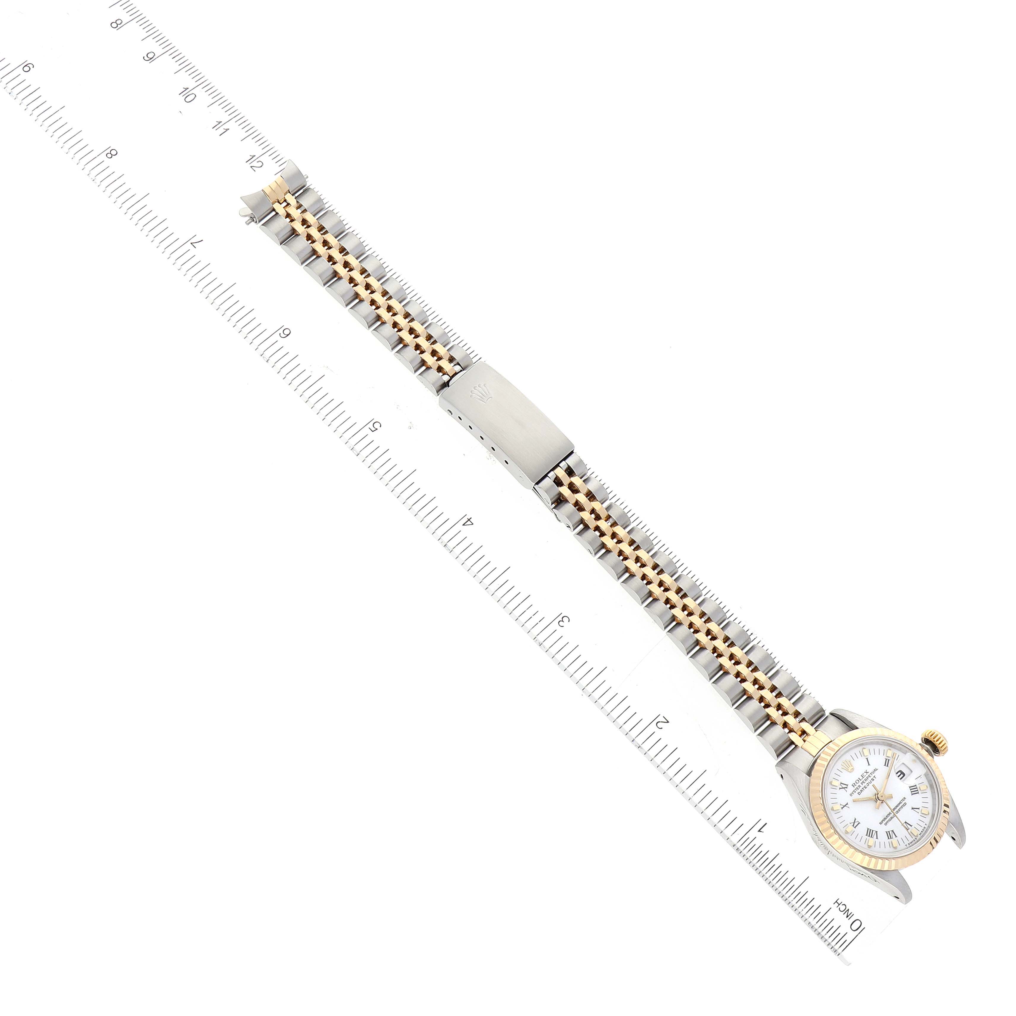 The image shows a Rolex Datejust 69173 Women's Steel and Gold (two tone) White Dial 69173 Women's Steel and Gold (two tone) White Dial watch laid flat with a ruler for scale, displaying the full bracelet and watch face.