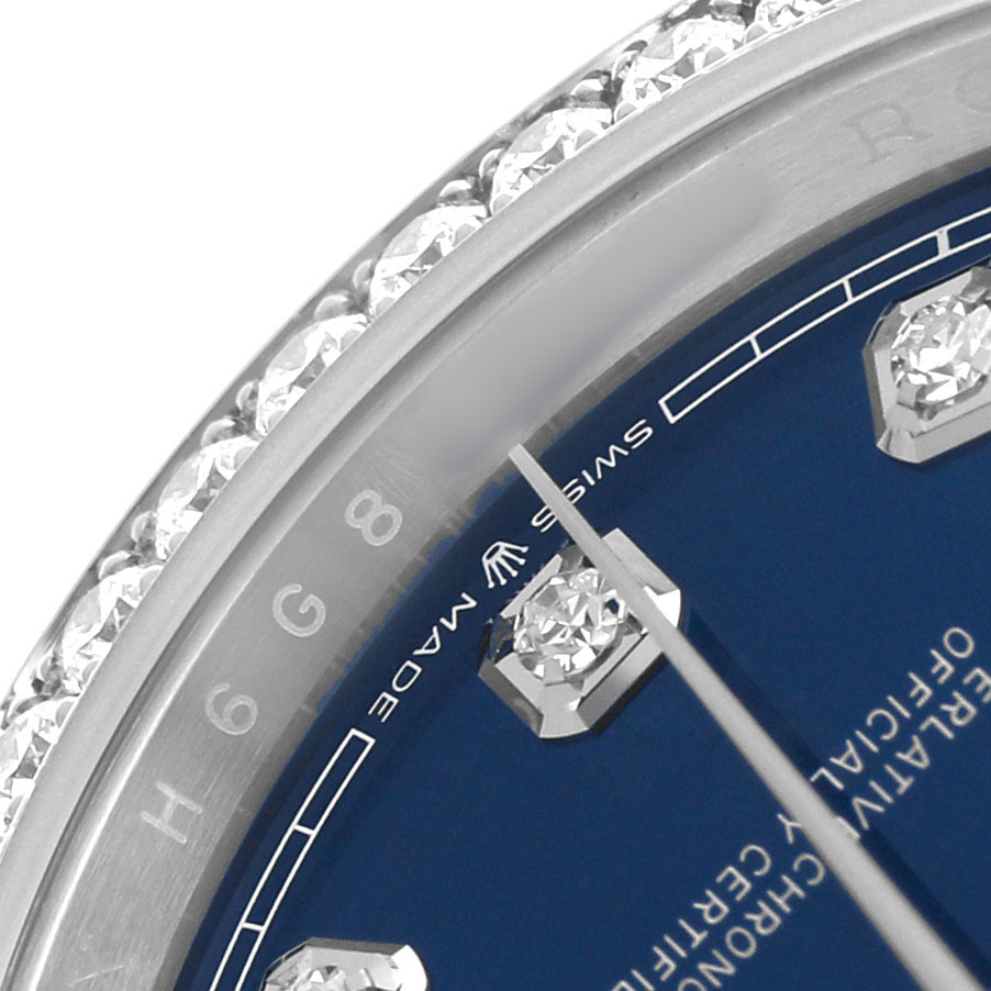 The image shows a close-up of the Rolex Datejust 126284RBR Men's Stainless Steel Beige Dial model, focusing on the diamond-set bezel and part of the blue dial with markers.