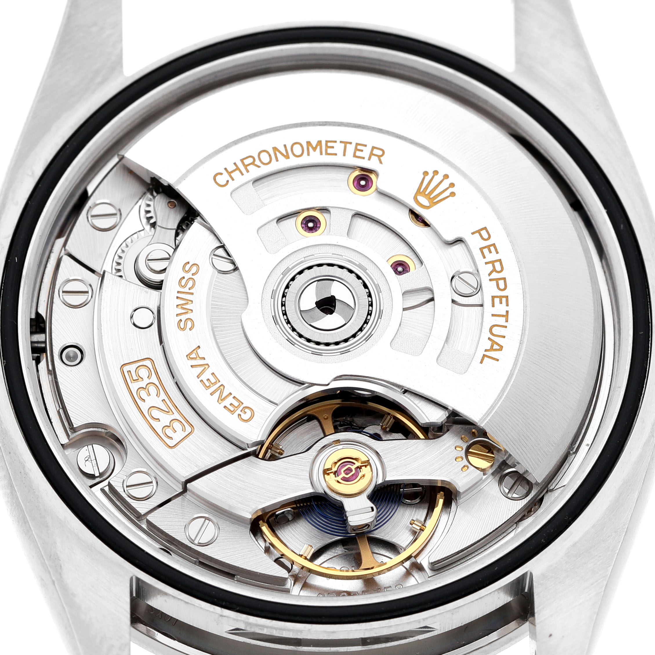 The image shows the movement and rotor of the Rolex Datejust 126284RBR Men's Stainless Steel Beige Dial from the back with intricate detailing.