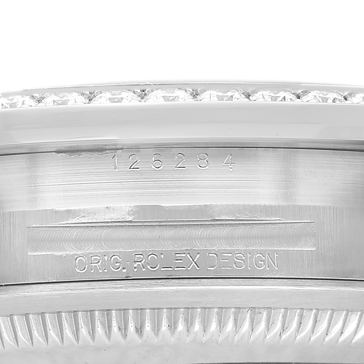 The image shows a close-up of the Rolex Datejust 126284RBR Men's Stainless Steel Beige Dial's engraved side, highlighting the model number and branding.