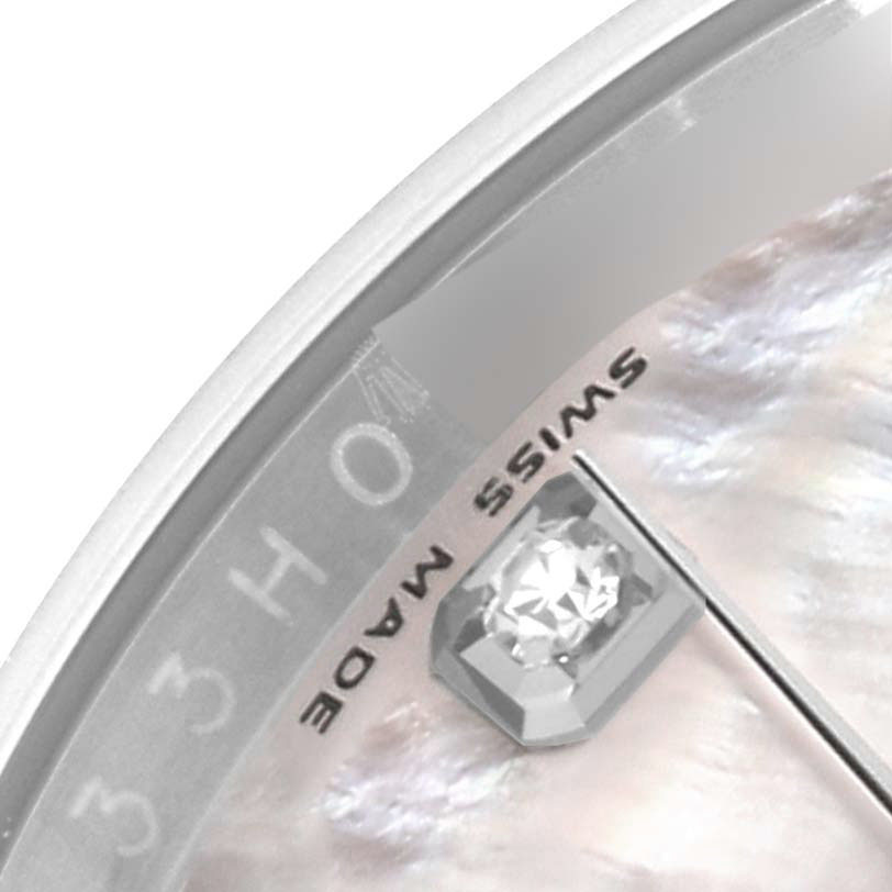 The image shows a close-up of the dial edge on a Rolex Datejust 116234 Men's Stainless Steel Mother of Pearl Dial, featuring a "Swiss Made" inscription and a diamond hour marker.