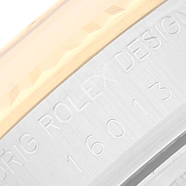 This close-up image shows the engraved side of a Rolex Vintage Collection 16013 Men's Steel and Gold (two tone) Champagne Dial 16013 Men's Steel and Gold (two tone) Champagne Dial watch case.