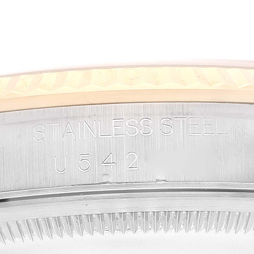 The image shows a close-up of the stainless steel bezel with an engraving on a Rolex Datejust 16233 Men's Steel and Gold (two tone) Champagne Dial 16233 Men's Steel and Gold (two tone) Champagne Dial watch.