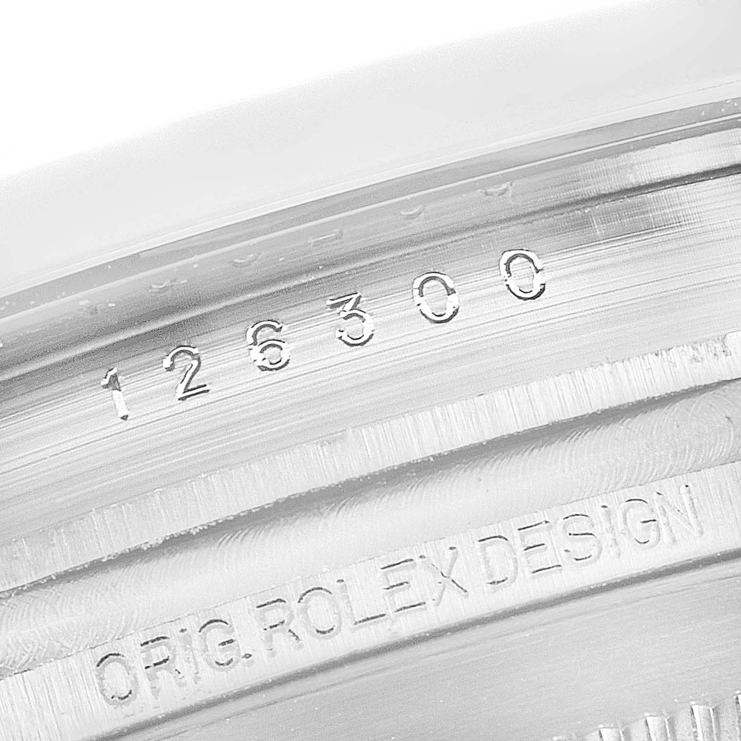 This is a close-up view of the inner bezel showing the engraved model number and "ORIG. ROLEX DESIGN" inscription of the Rolex Datejust 41 126300 Men's Stainless Steel Blue Dial 126300 Men's Stainless Steel Blue Dial.
