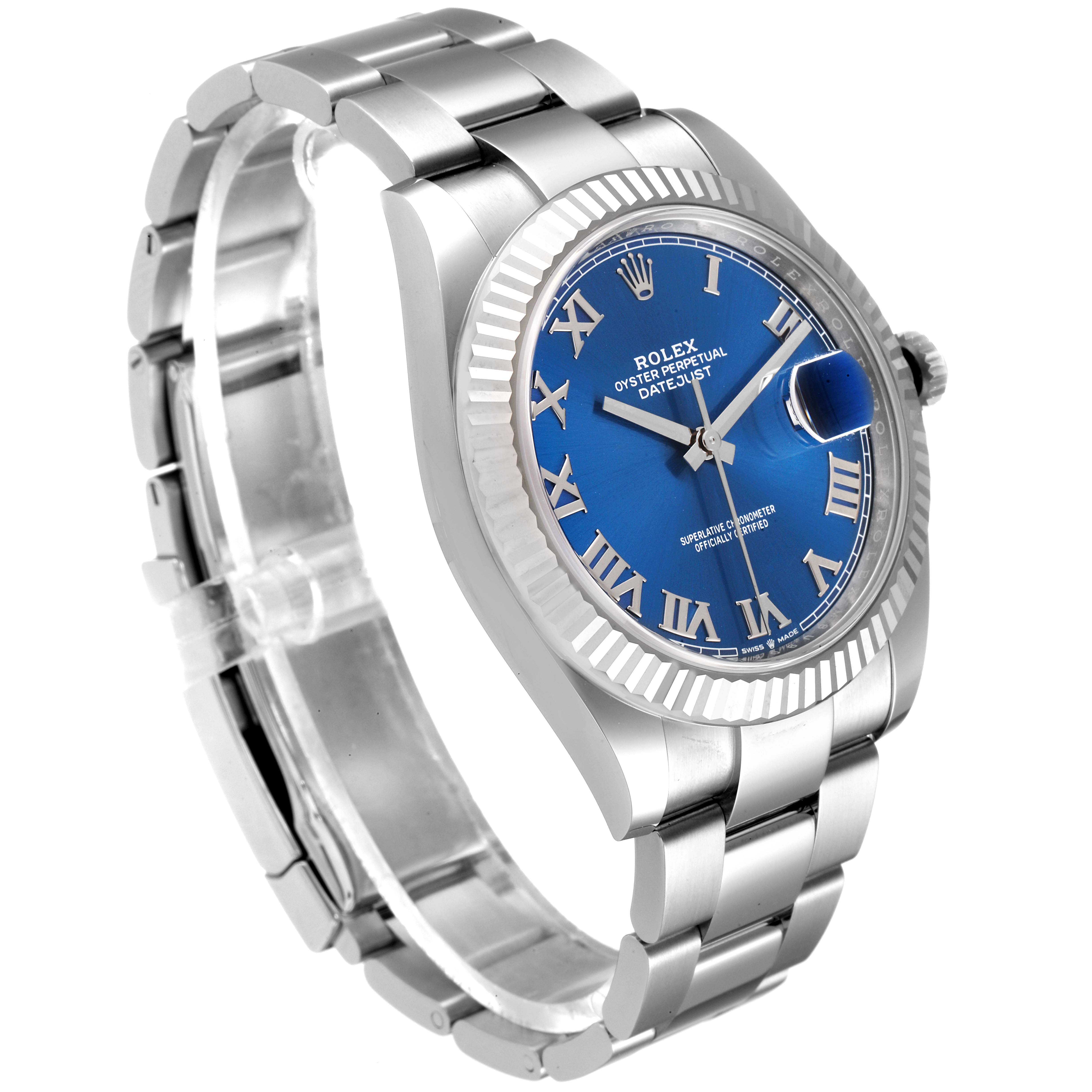 The image shows a Rolex Datejust 41 126334 Men
s Stainless Steel Blue Dial 126334 Men
s Stainless Steel Blue Dial watch at a three-quarter angle, highlighting its blue dial, fluted bezel, and stainless steel bracelet.