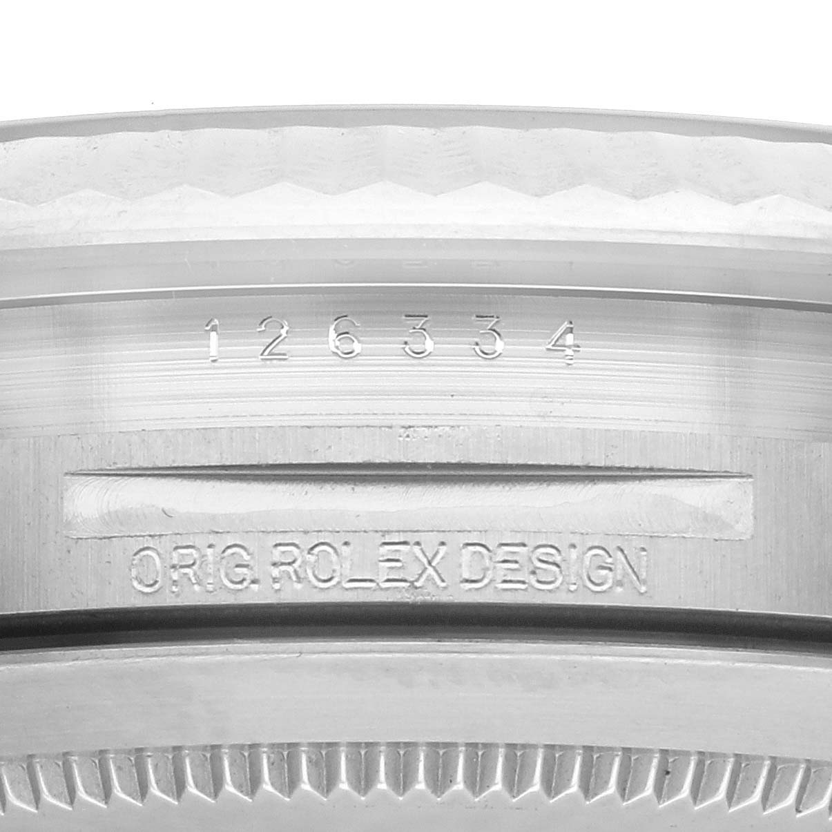 The image shows a close-up of the serial and model numbers engraved on the case side of a Rolex Datejust 41 126334 Men
s Stainless Steel White Dial 126334 Men
s Stainless Steel White Dial.
