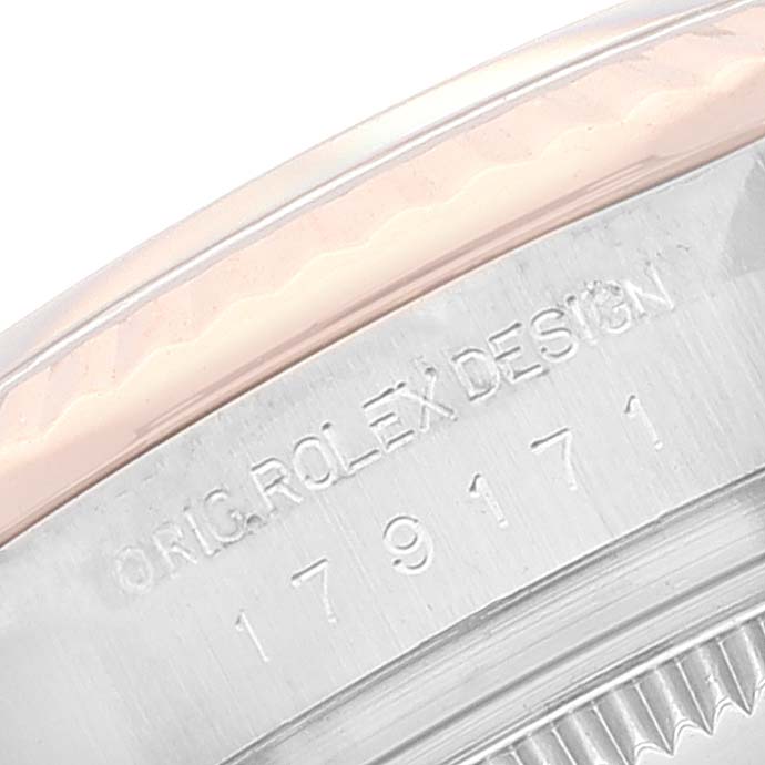 This close-up image shows the edge and engraved side of a Rolex Datejust 179171 Women's Steel and Gold (two tone) White Dial 179171 Women's Steel and Gold (two tone) White Dial watch casing.