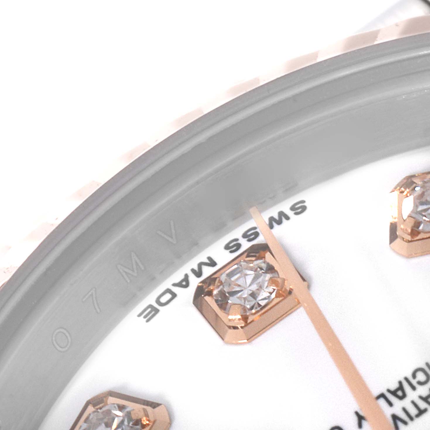 This is a close-up of a Rolex Datejust 179171 Women's Steel and Gold (two tone) White Dial 179171 Women's Steel and Gold (two tone) White Dial watch, showing part of the dial with diamond hour markers and the "SWISS MADE" text.
