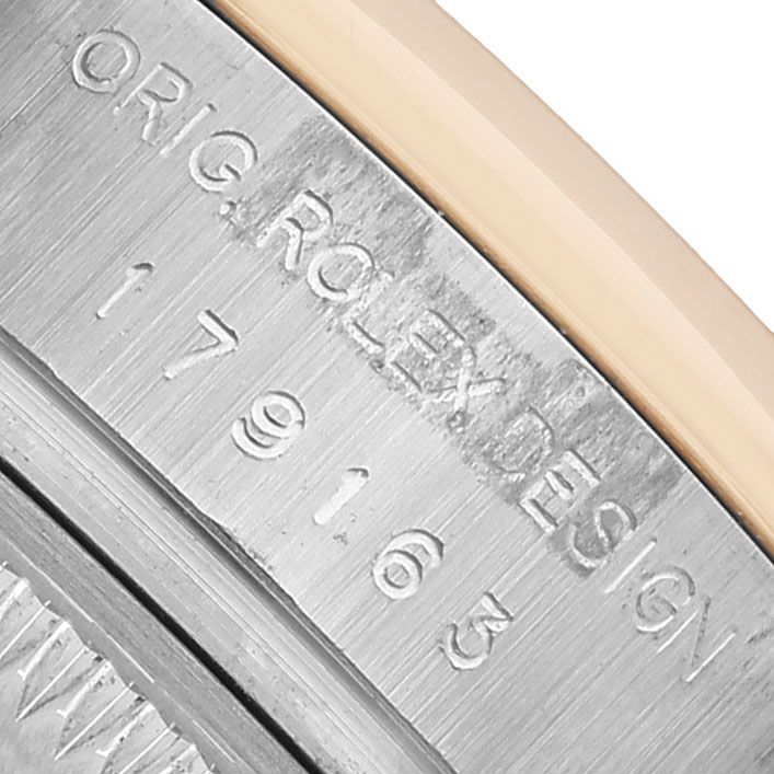 The image shows a close-up of the Rolex Datejust 179163 Women's Steel and Gold (two tone) Blue Dial watch case, highlighting the model number and "ORIG ROLEX DESIGN" engraving.