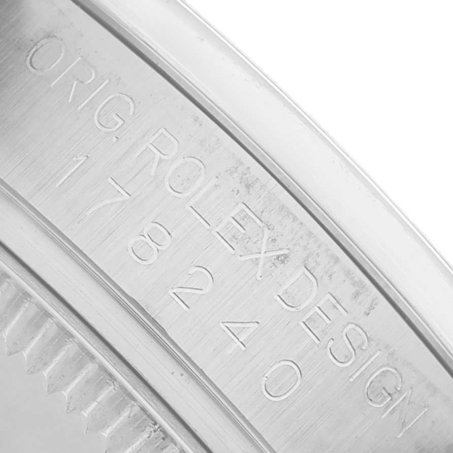The image shows a close-up of the engraved case edge of a Rolex Datejust 178240 Women's Stainless Steel Pink Dial, highlighting the model and brand details.