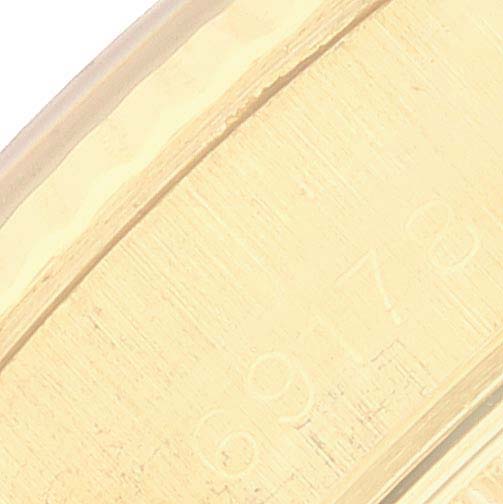 The image shows a close-up of the side of the case of a Rolex President 69178 Women's Yellow Gold Blue Dial 69178 Women's Yellow Gold Blue Dial model watch, highlighting the serial number.