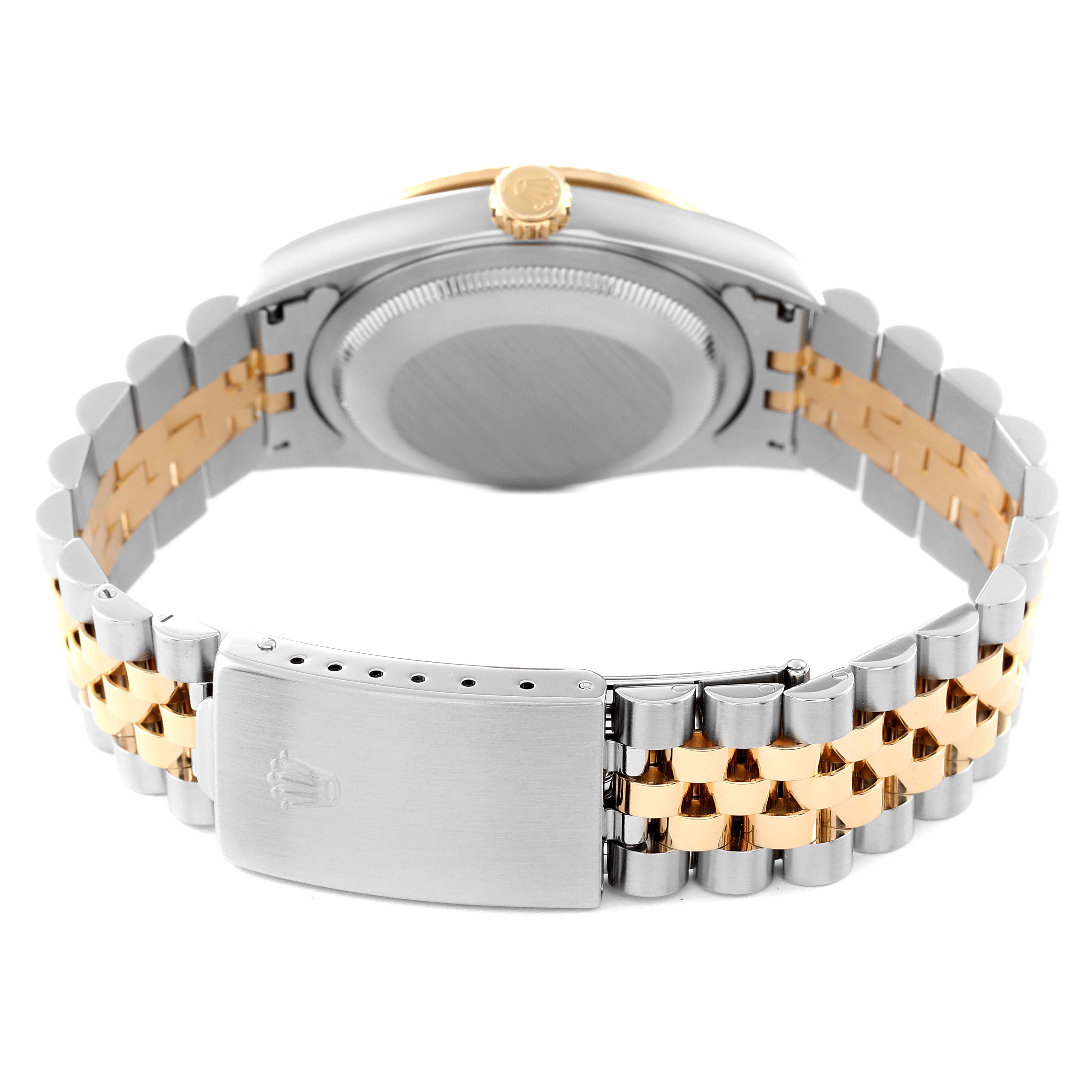 The back view of the Rolex Datejust 16233 Men's Steel and Gold (two tone) Beige Dial 16233 Men's Steel and Gold (two tone) Beige Dial watch shows the case back and the two-tone metal bracelet with the clasp.