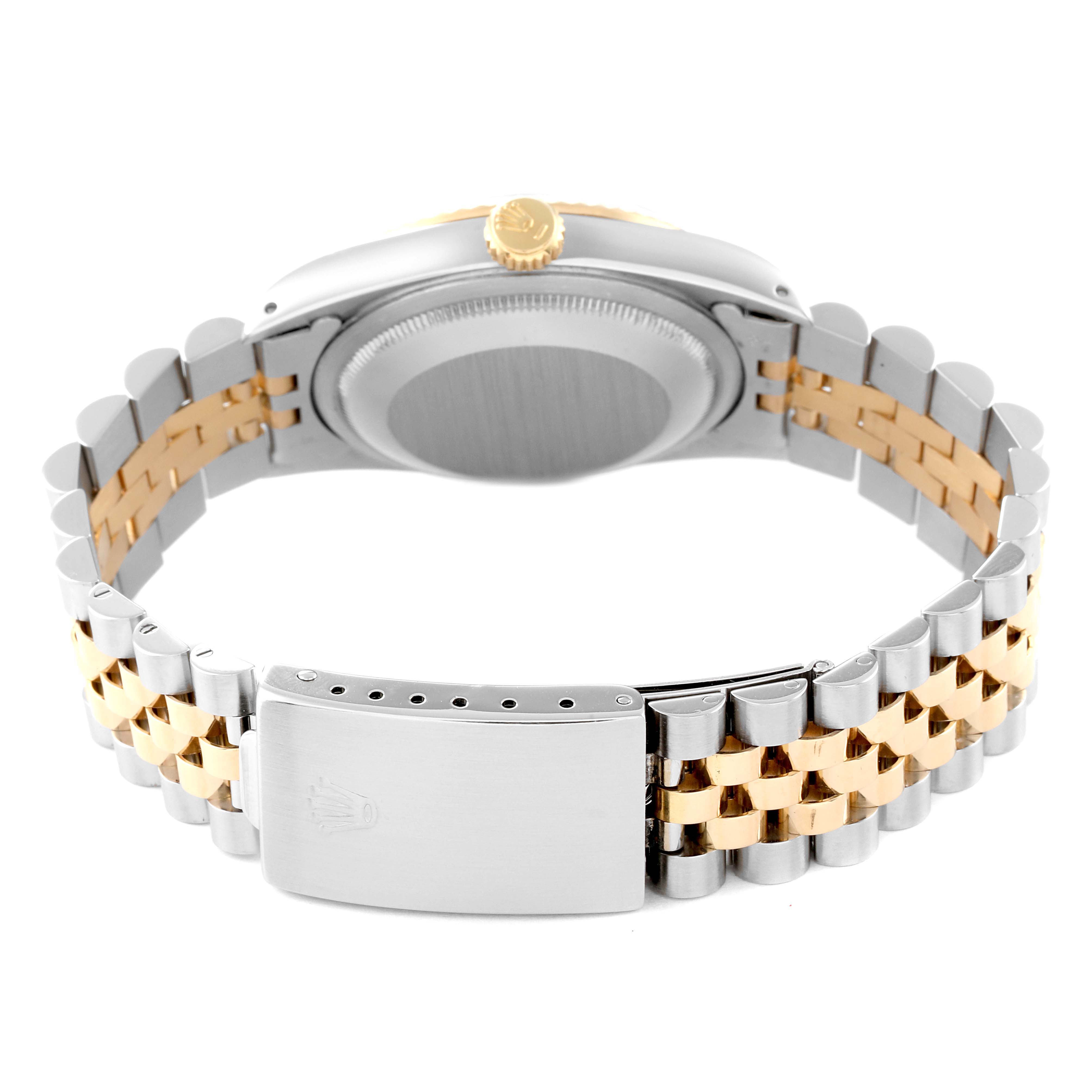 This image shows the bracelet, clasp, and back case of a Rolex Datejust 16233 Men's Steel and Gold (two tone) Champagne Dial 16233 Men's Steel and Gold (two tone) Champagne Dial in a rear angle view.