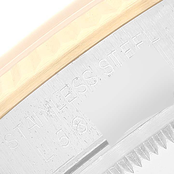 The image shows a close-up of the side of the Rolex Datejust 16233 Men's Steel and Gold (two tone) Champagne Dial 16233 Men's Steel and Gold (two tone) Champagne Dial watch, focusing on the engraved text "STAINLESS STEEL."