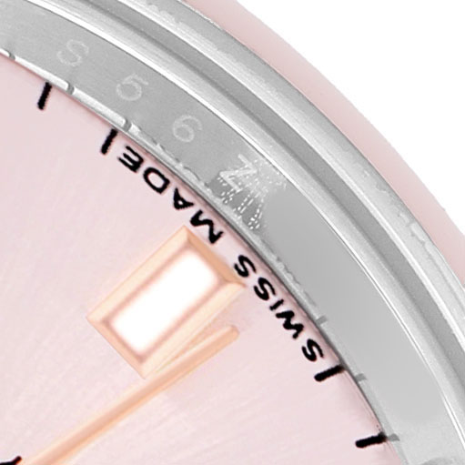 The image shows a close-up of the Rolex Datejust 179161 Women's Steel and Gold (two tone) Pink Dial watch dial with the bezel edge, focusing on the "Swiss Made" text.