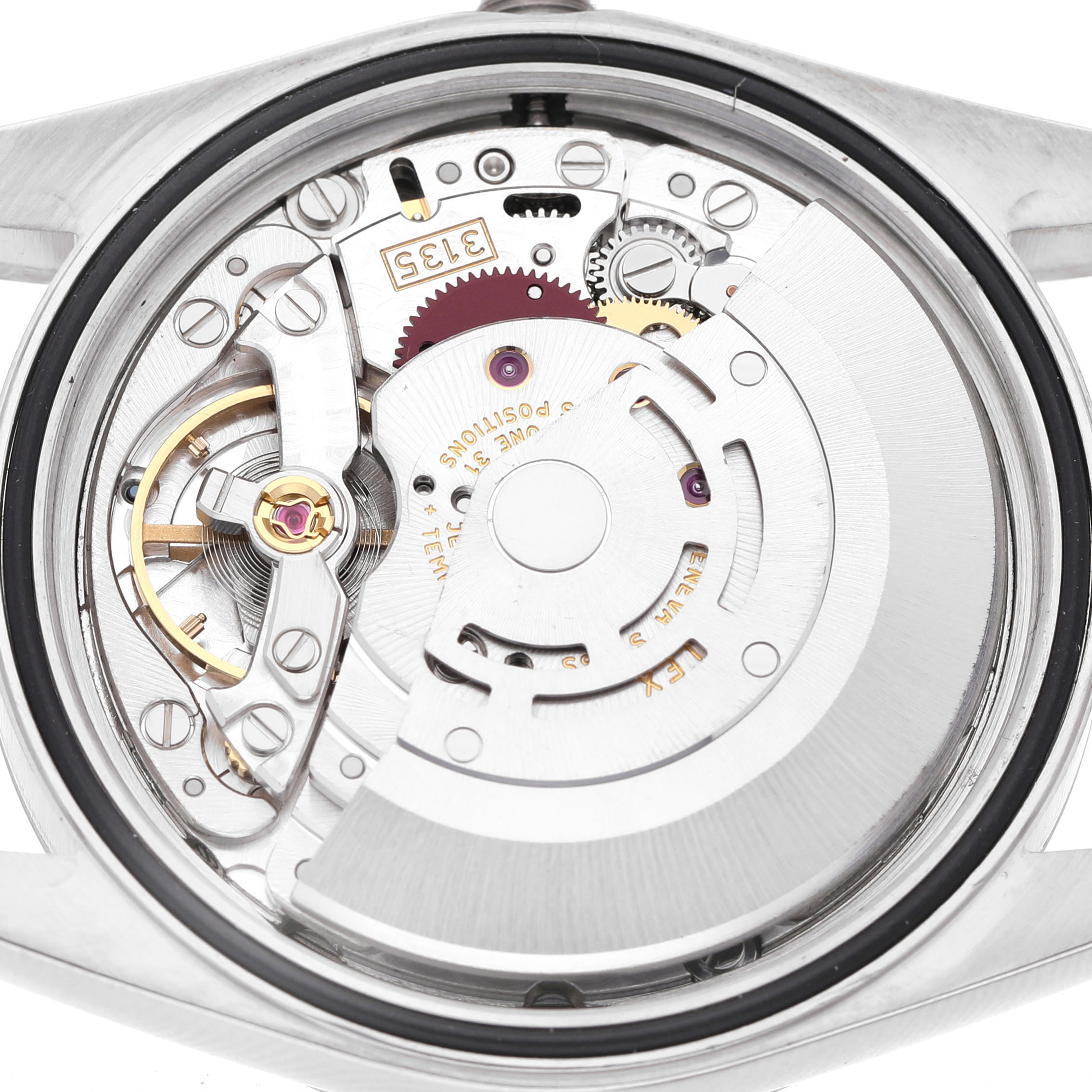 The image shows the movement of a Rolex Datejust 16234 Men's Stainless Steel Silver Dial watch from a rear view, highlighting the intricate mechanics.