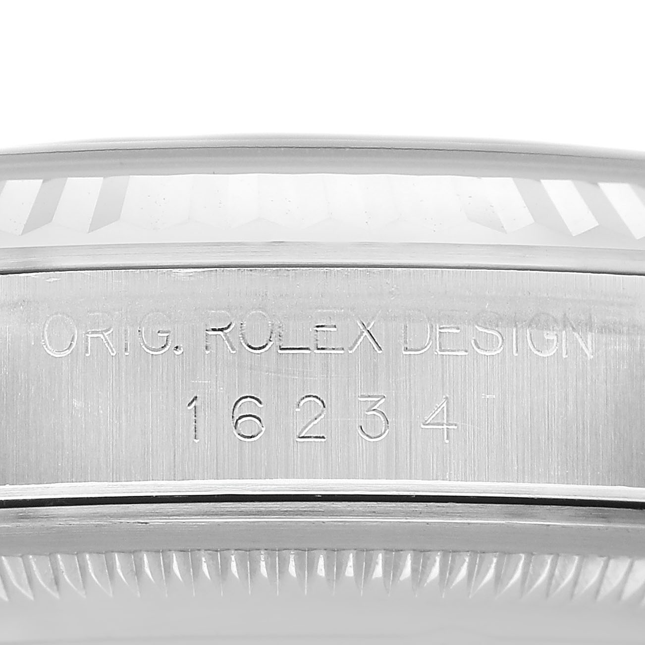 The image shows the side of the Rolex Datejust 16234 Men's Stainless Steel Silver Dial watch, highlighting the engraved model number and bezel edge.
