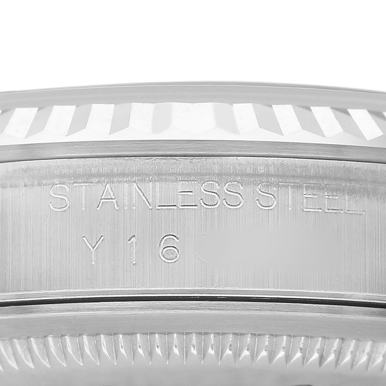 The image shows a close-up of the Rolex Datejust 16234 Men's Stainless Steel Silver Dial watch's case side, highlighting the stainless steel engravings and serrated edge.