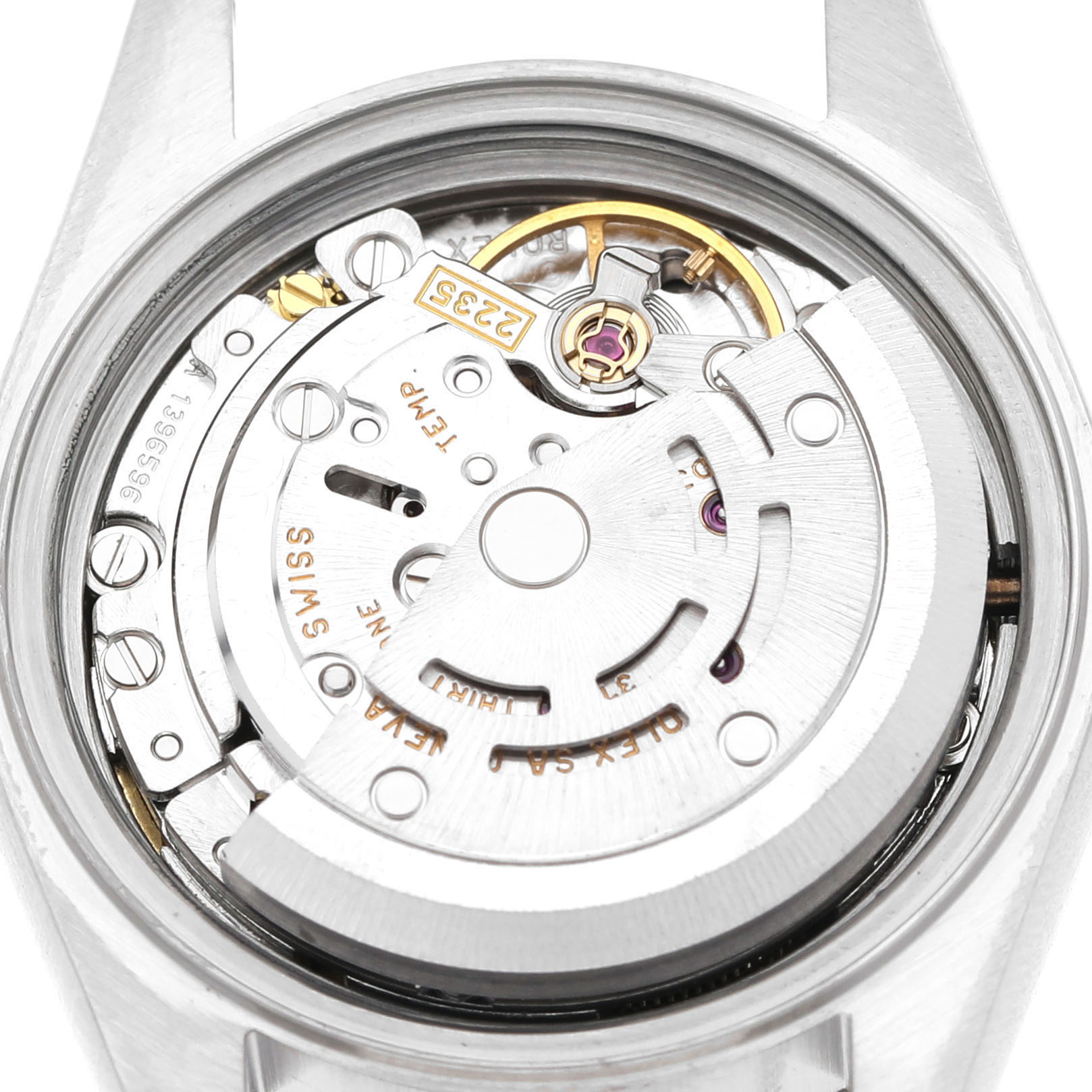 The image shows the movement of a Rolex Datejust 79174 Women's Stainless Steel Blue Dial watch from a top-down angle, revealing intricate parts like the rotor and gears.