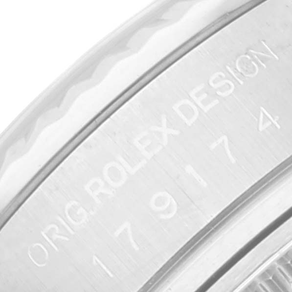 This close-up image shows the engraved side of the Datejust Rolex watch's case with the model number 179174.