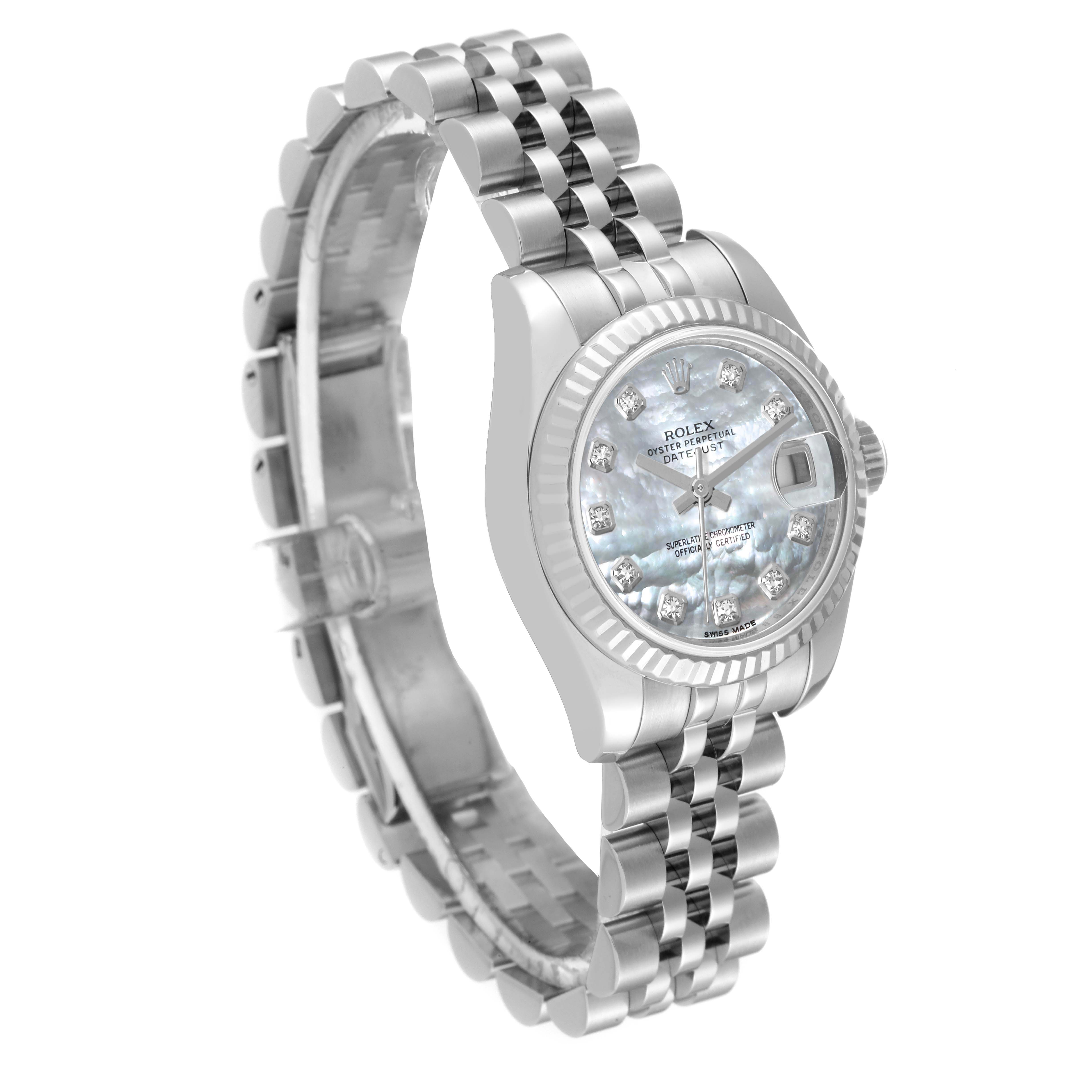 This image shows a Rolex Datejust 179174 Women's Stainless Steel Mother of Pearl Dial 179174 Women's Stainless Steel Mother of Pearl Dial watch angled slightly from the top, showcasing its dial, fluted bezel, and Jubilee bracelet.