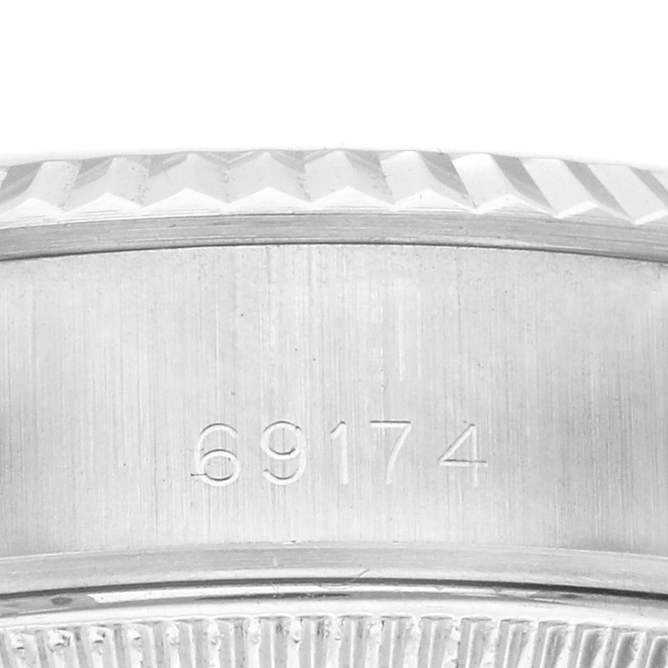 The image shows a close-up of the model number "69174" engraved on the side of a Rolex Datejust 69174 Women's Stainless Steel Silver Dial 69174 Women's Stainless Steel Silver Dial watch case.
