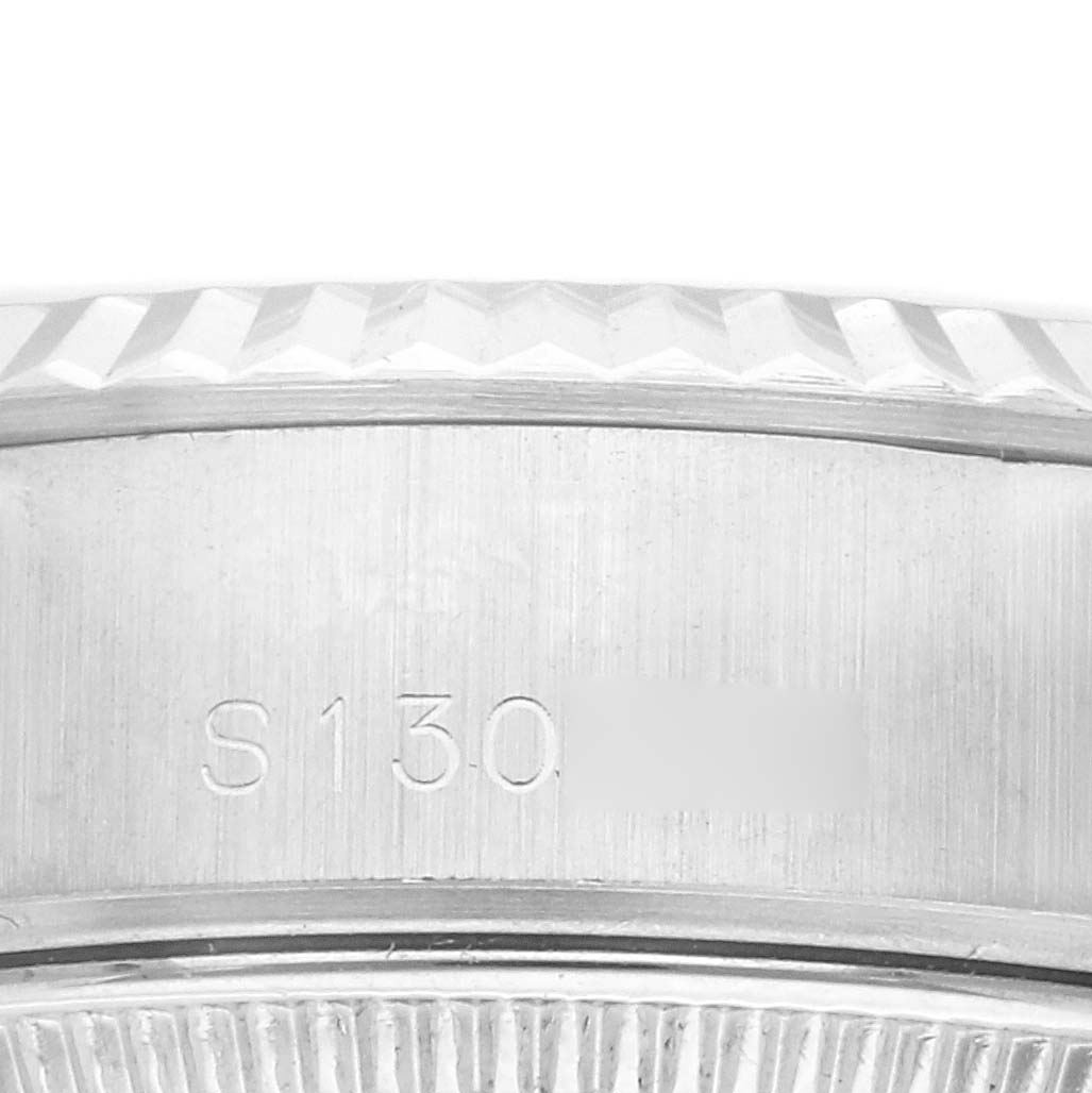 The image shows the engraved side of the Rolex Datejust 69174 Women's Stainless Steel Silver Dial 69174 Women's Stainless Steel Silver Dial, highlighting the case and bezel details.