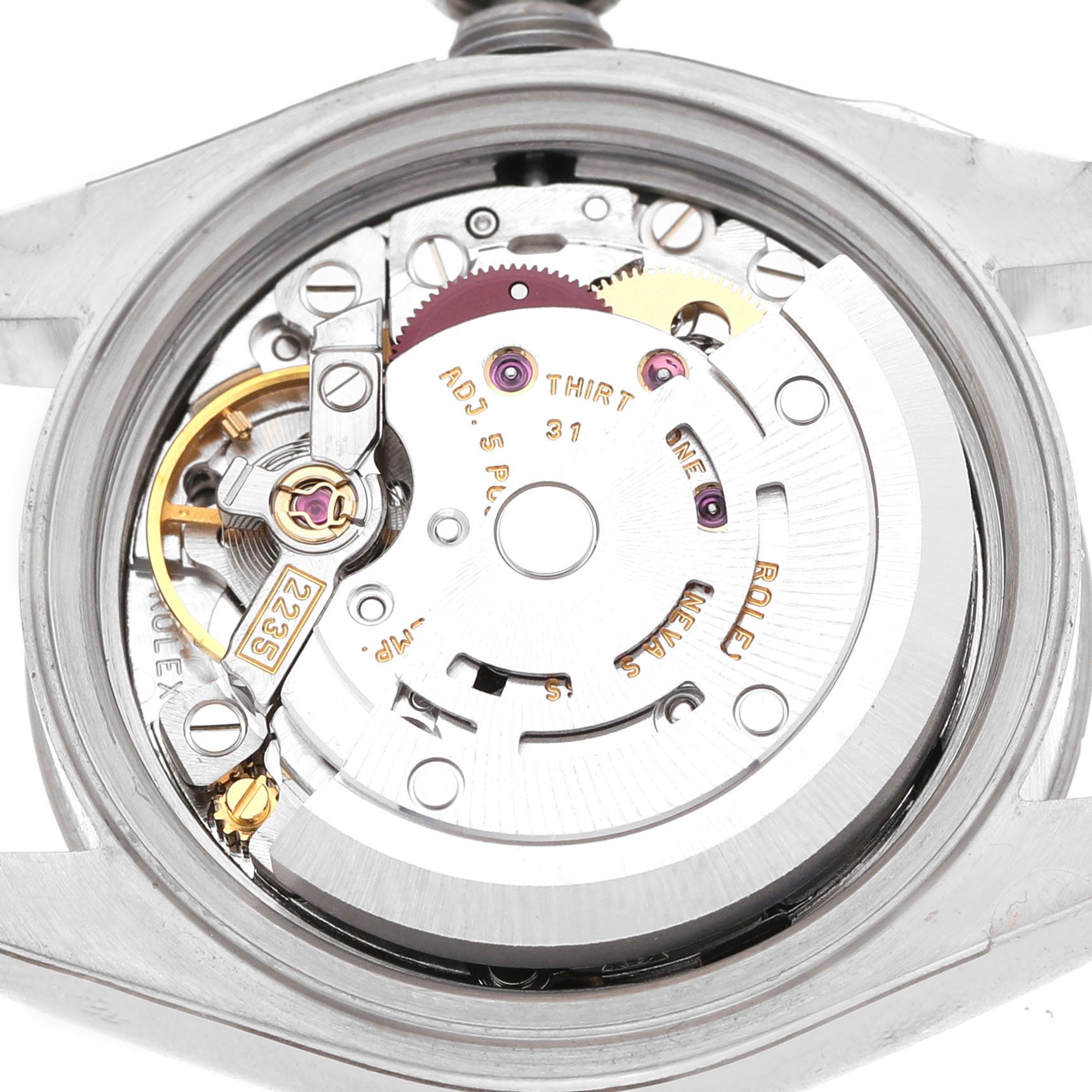 The image shows the movement of a Rolex Datejust 179174 Women's Stainless Steel White Dial, viewed from the back, revealing its intricate mechanics.