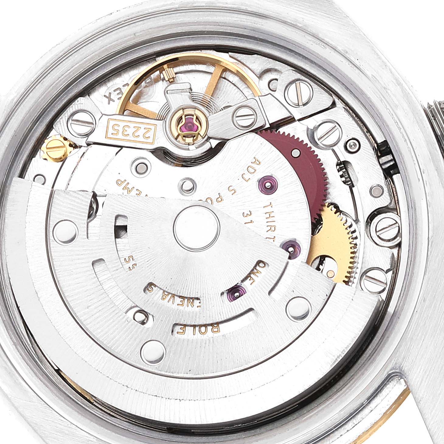 The image shows a close-up of the movement mechanism of a Rolex Datejust 179173 Women's Steel and Gold (two tone) Champagne Dial 179173 Women's Steel and Gold (two tone) Champagne Dial watch, highlighting its intricate inner components.