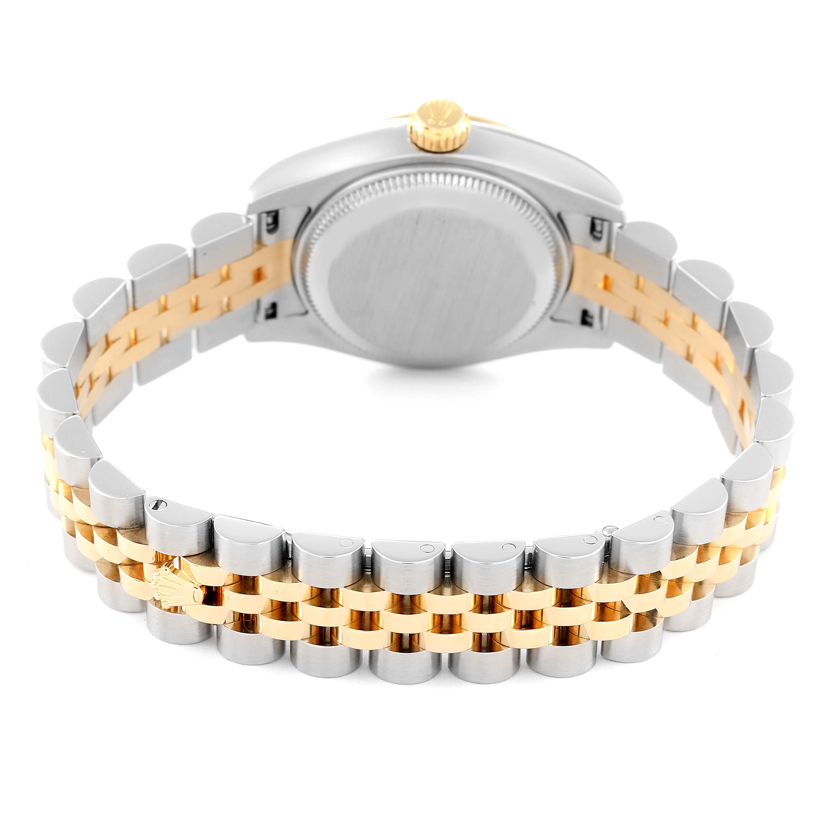 The image shows the back view of a Rolex Datejust 179173 Women's Steel and Gold (two tone) Champagne Dial 179173 Women's Steel and Gold (two tone) Champagne Dial watch, focusing on its two-tone metal bracelet and case back.