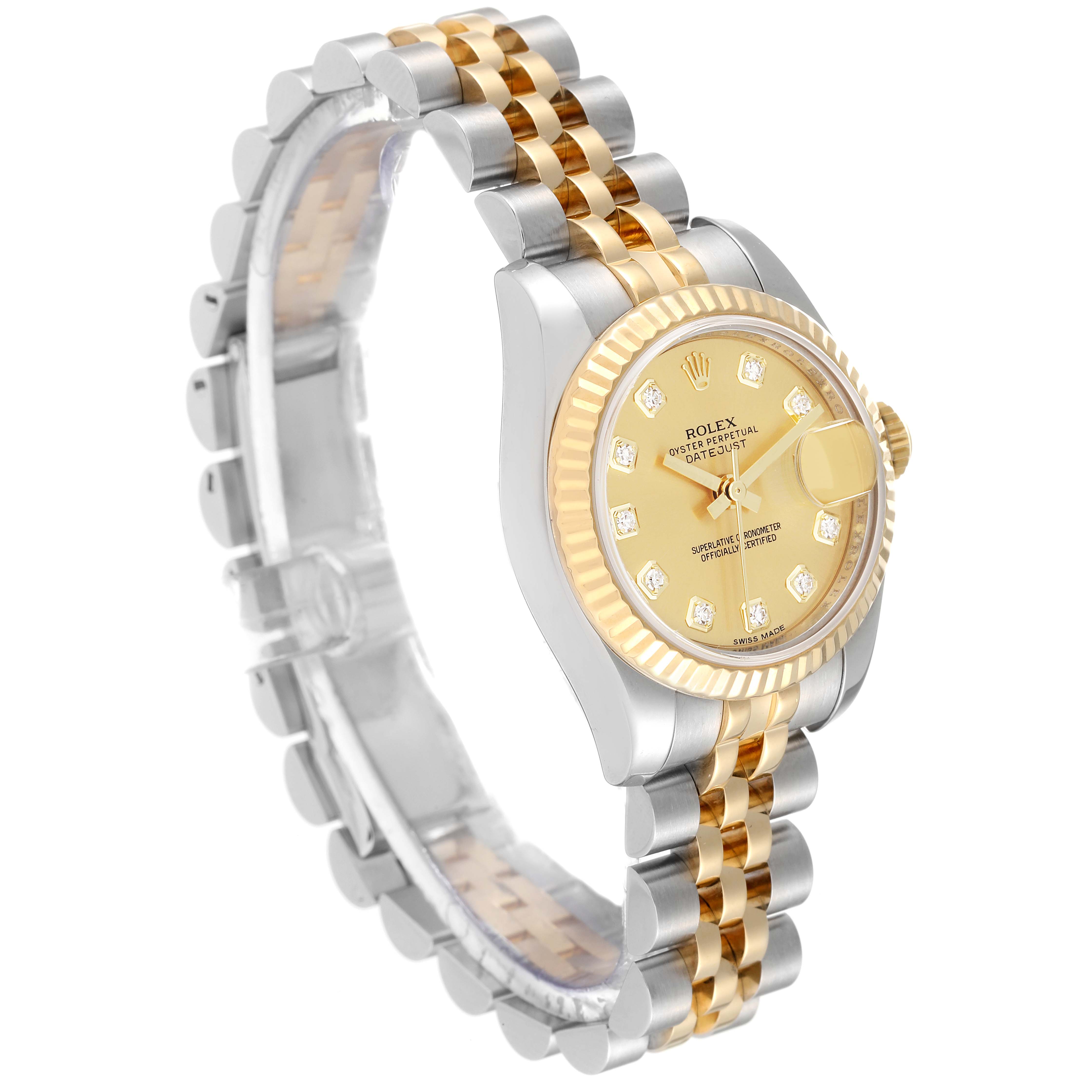 The image shows a Rolex Datejust 179173 Women's Steel and Gold (two tone) Champagne Dial 179173 Women's Steel and Gold (two tone) Champagne Dial model watch at an oblique angle, highlighting its two-tone bracelet and diamond-studded gold dial.