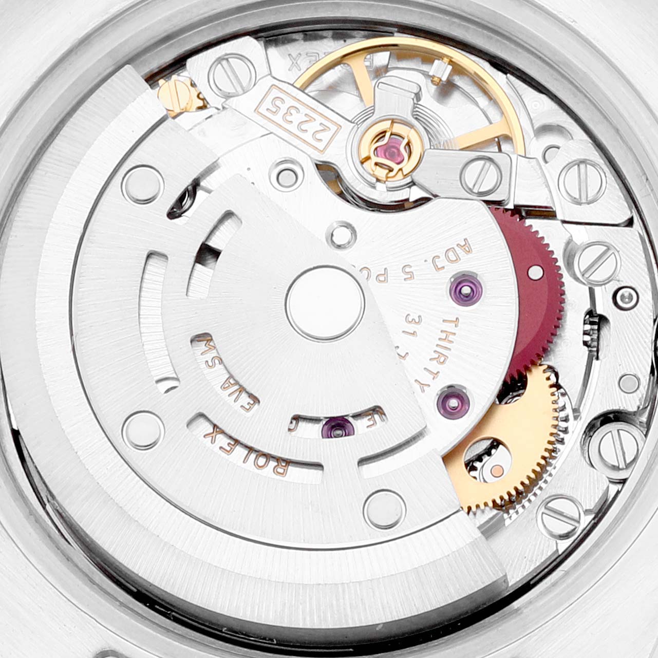 This image shows a close-up view of the movement inside a Rolex Datejust 179383 Women's Steel and Gold (two tone) Silver Dial 179383 Women's Steel and Gold (two tone) Silver Dial watch, specifically the intricate gears and rotor.