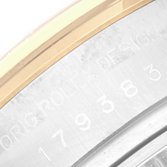 This image shows a close-up angle of the bezel and part of the engraved case of a Rolex Datejust 179383 Women's Steel and Gold (two tone) Silver Dial 179383 Women's Steel and Gold (two tone) Silver Dial watch.